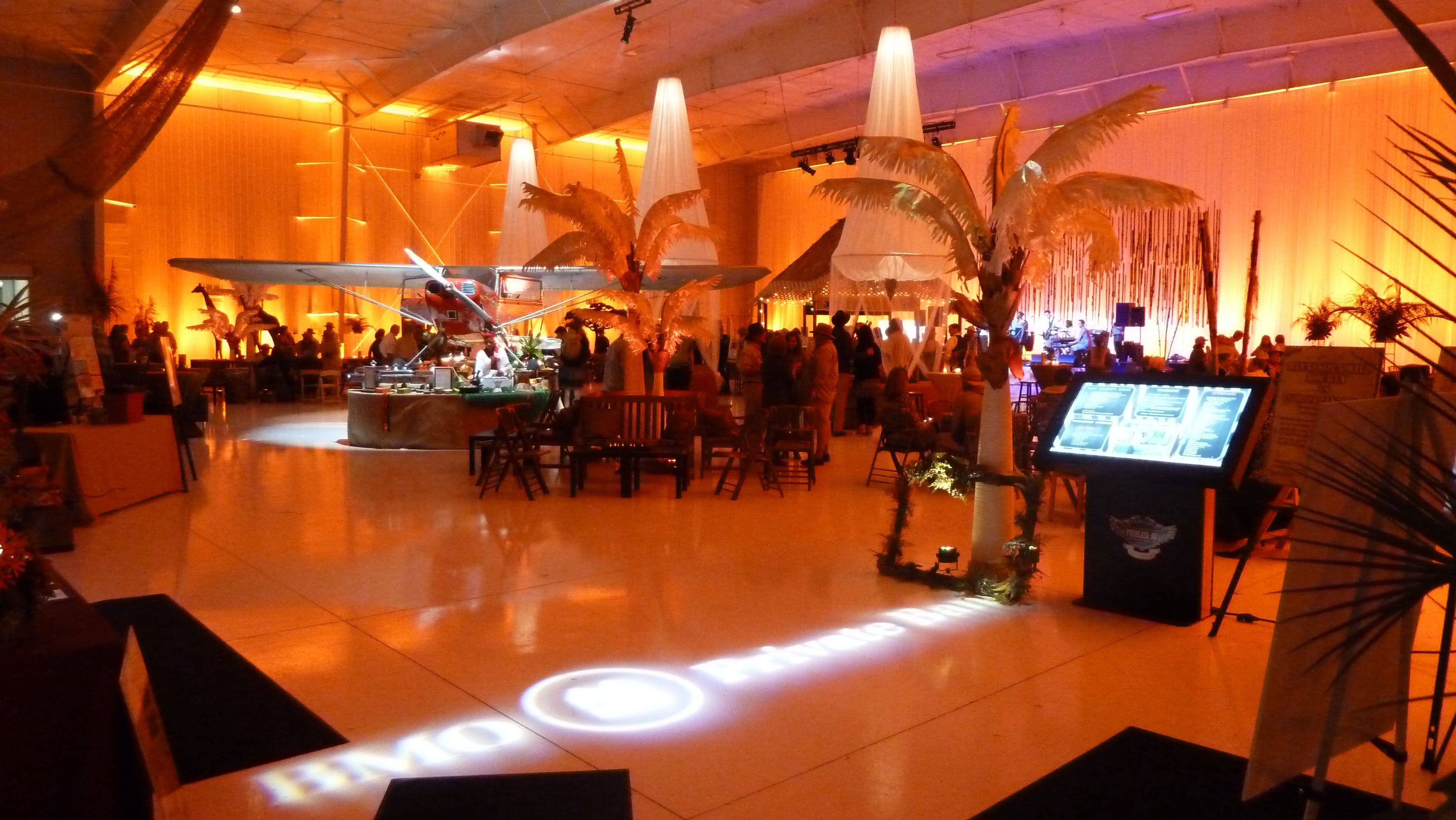 African Sahara sunset themed party in an airport Hanger. Decor by Event Lab, Lighting by Duluth Event Lighting.