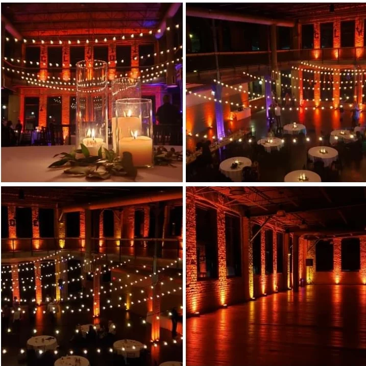 Clyde Iron Works wedding lighting in sunset orange up lighting by Duluth Event Lighting.