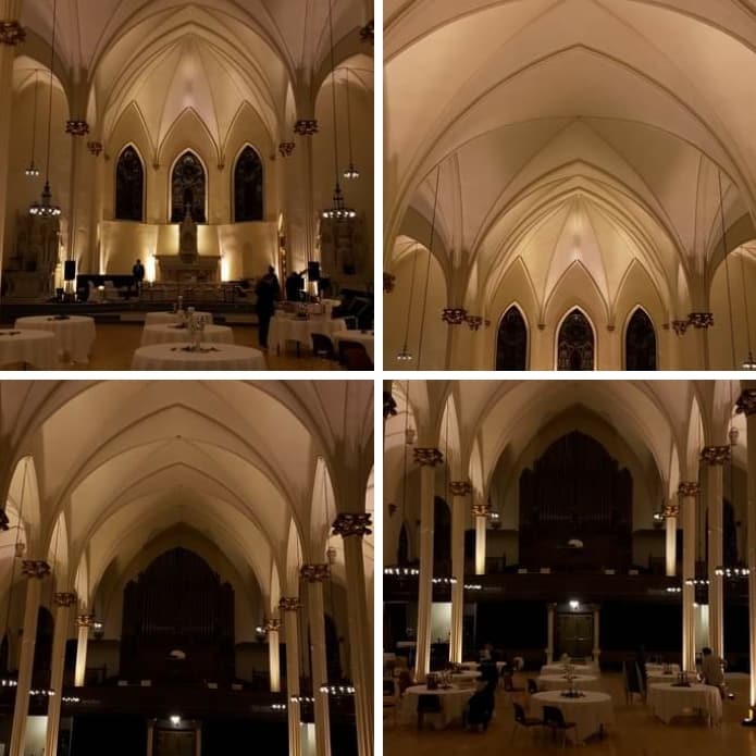 Wedding lighting at Sacred Heart with soft gold up lighting by Duluth Event Lighting.