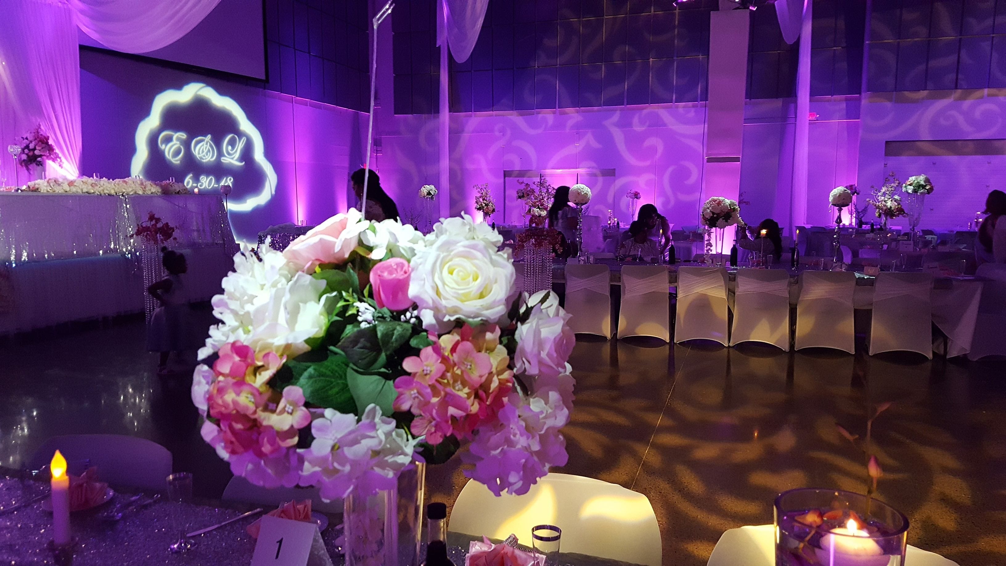 Wedding lighting at the Passion Event Center. Pin spots to highlight the floral centerpeices.