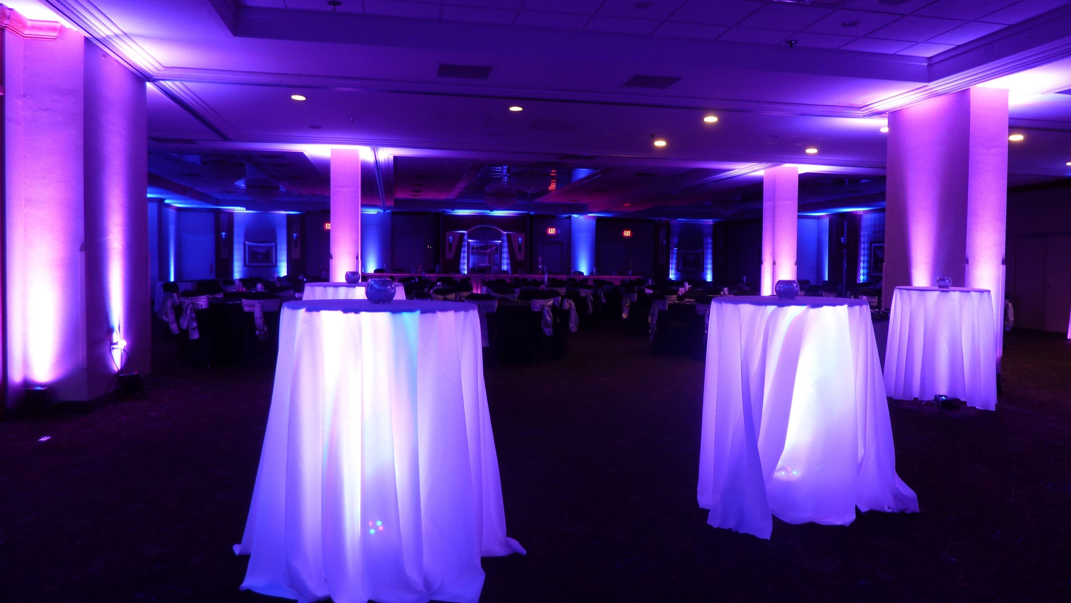 purple and magenta pink wedding lighting at the Holiday Inn. Glowing Cocktail tables.