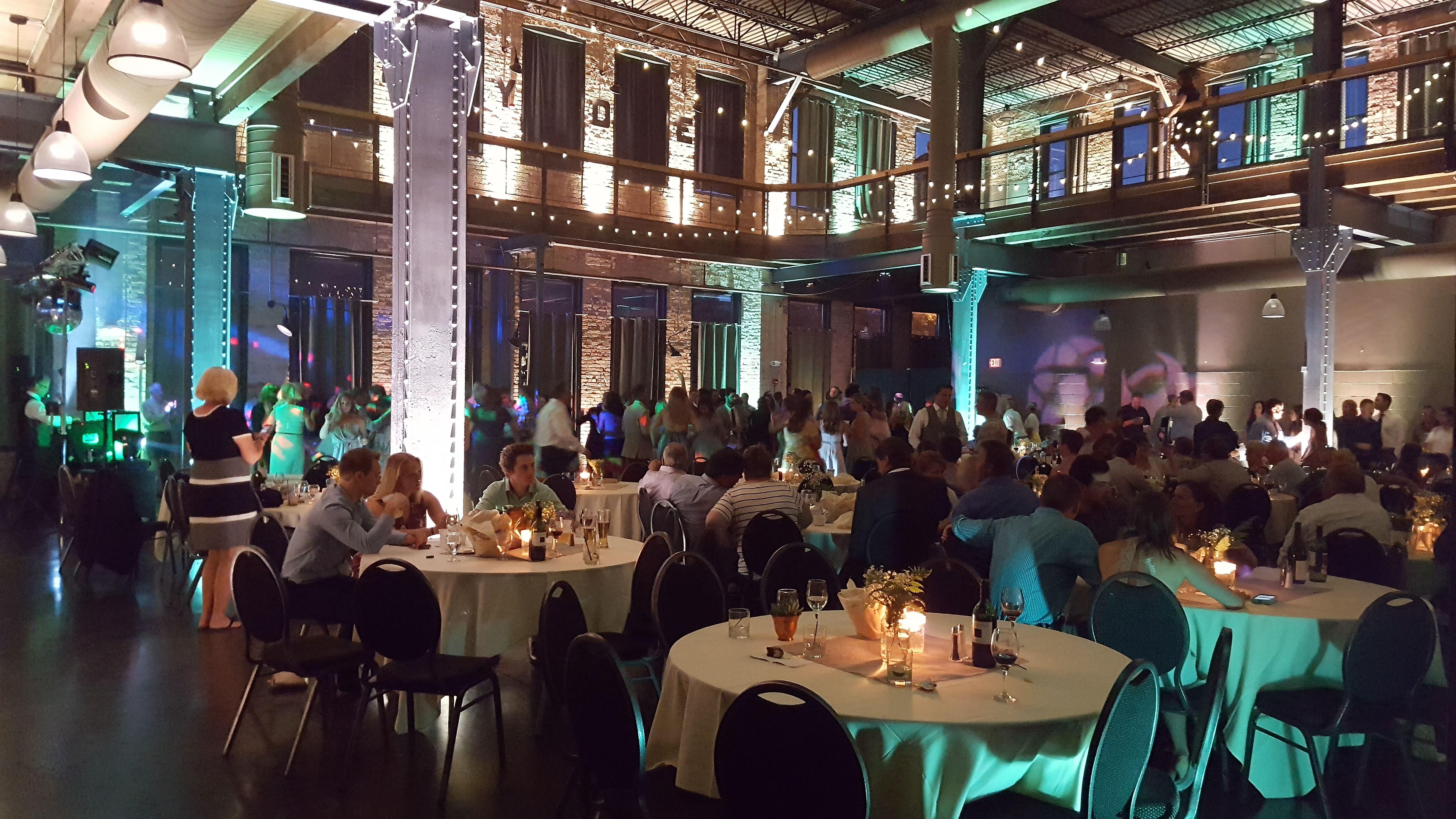 Wedding lighting at Clyde Iron Works. Up lighting in mint green and warm white with bistro.