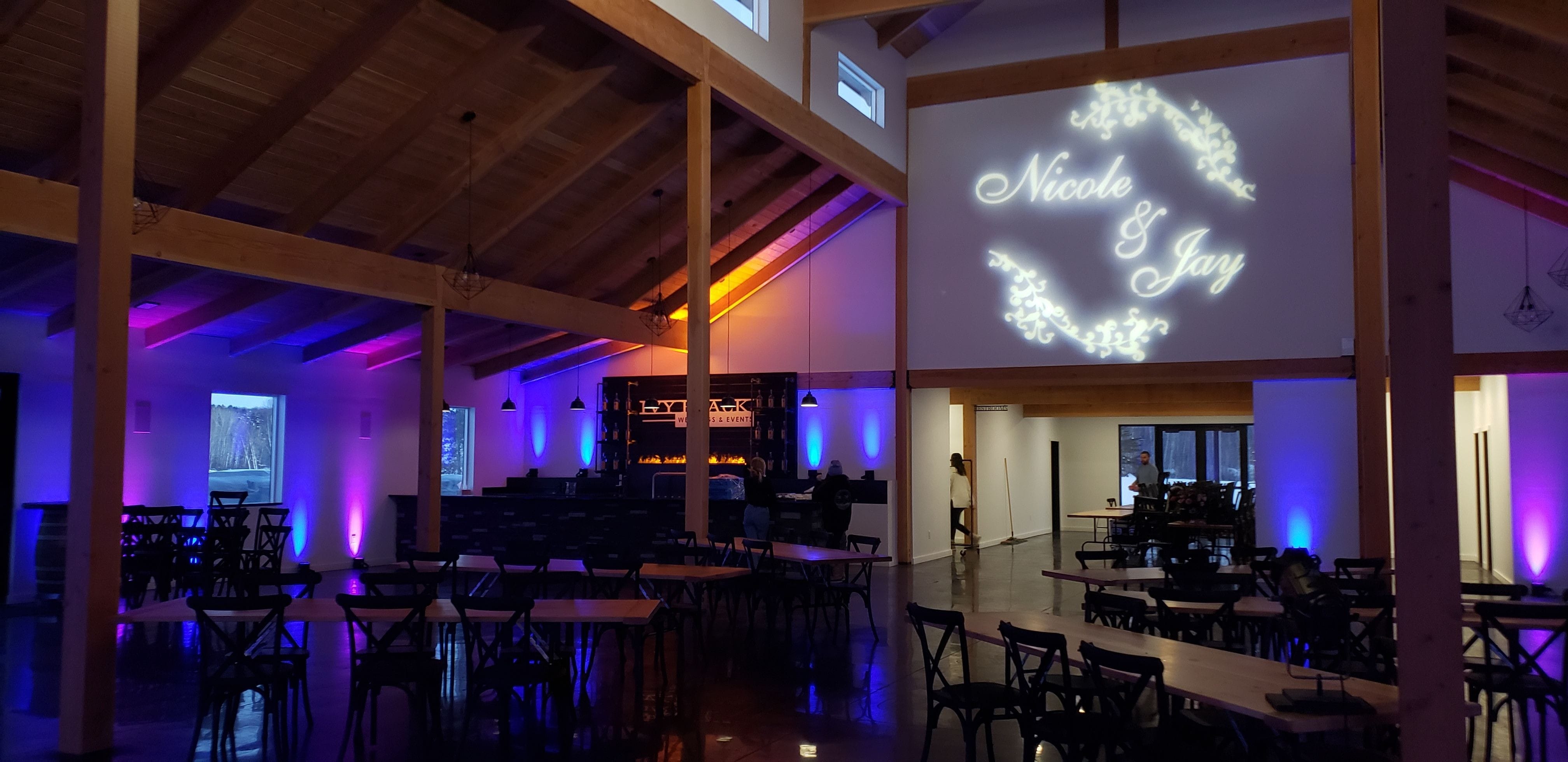 Ivy Black wedding lighting with blue and purple up lighting and a wedding monogram by Duluth Event Lighting
