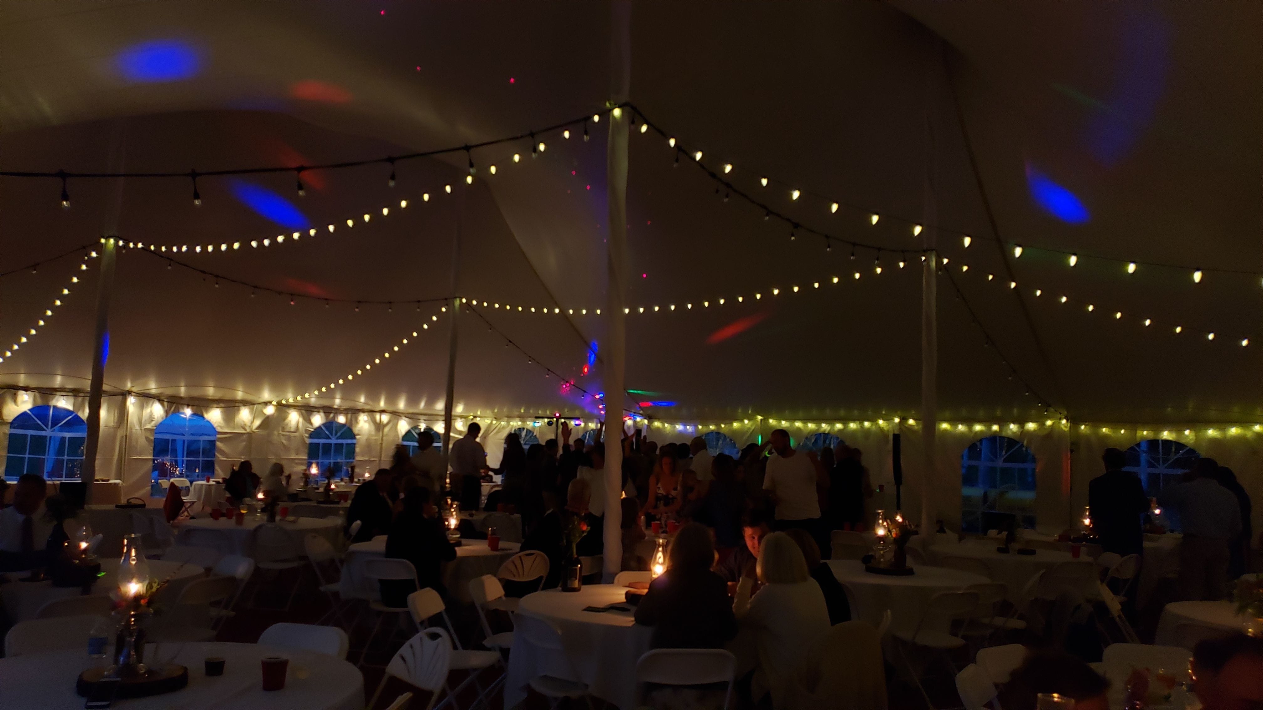 Tent wedding lighting. Bistro. A darkened tent with the brighter set of bistro turned off.
