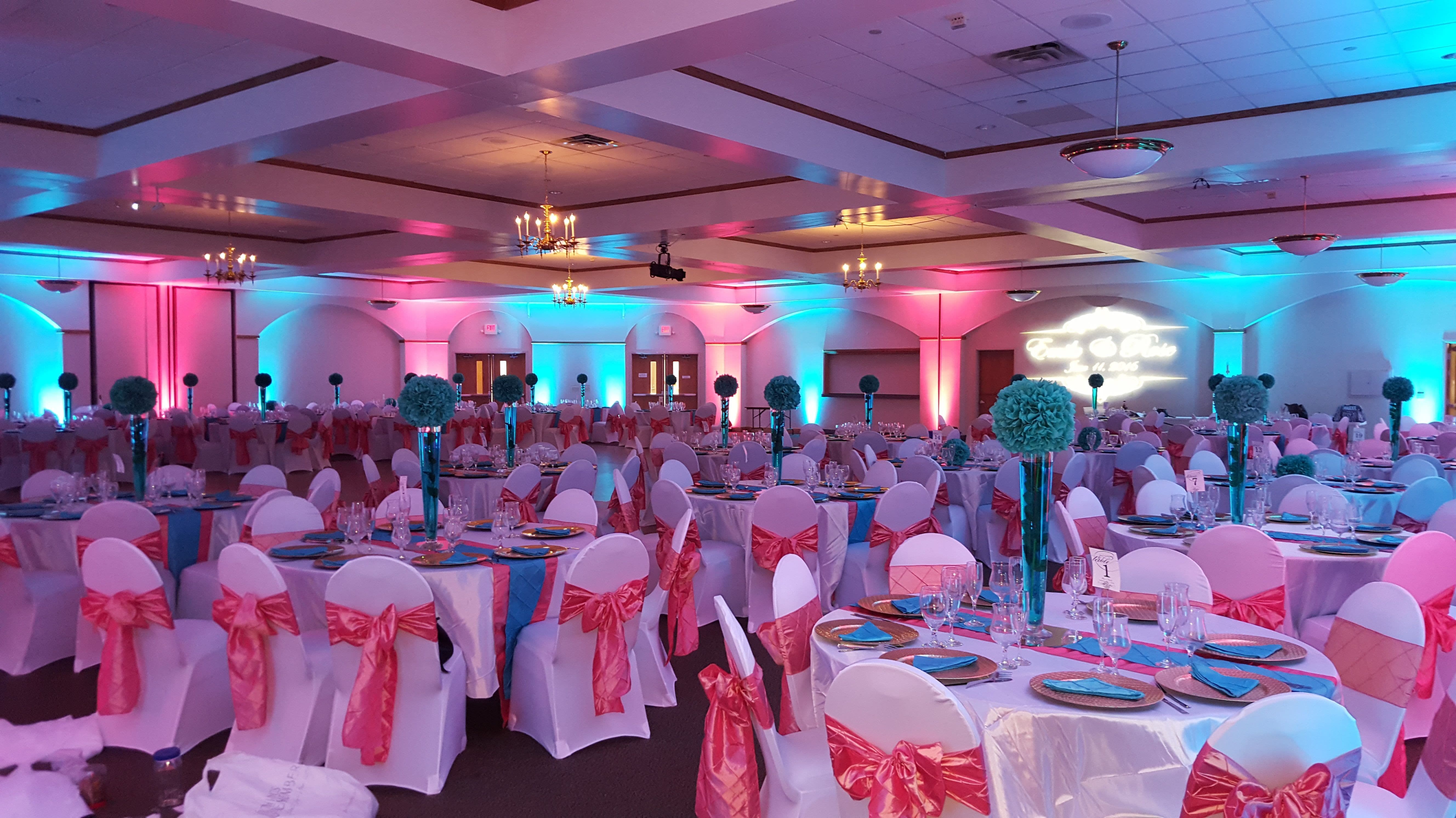 Wedding lighting at the Cedars Hall in Minneapolis. Up lighting in teal and coral.