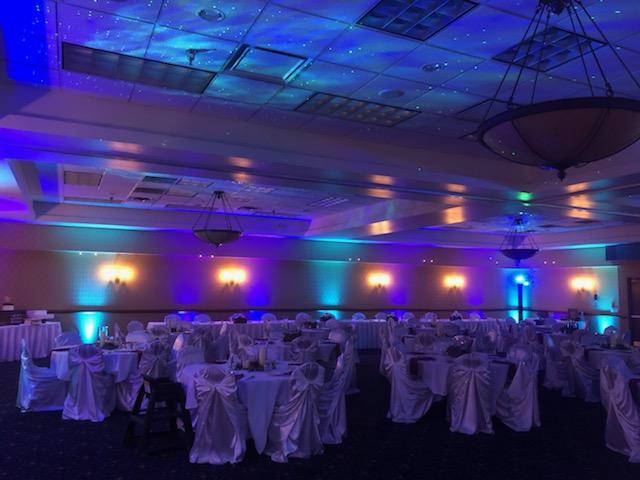 Northern Lights ballroom at the Inn on Lake Superior with wedding lighting. Stars and Northern Lights dancing on the ceiling.