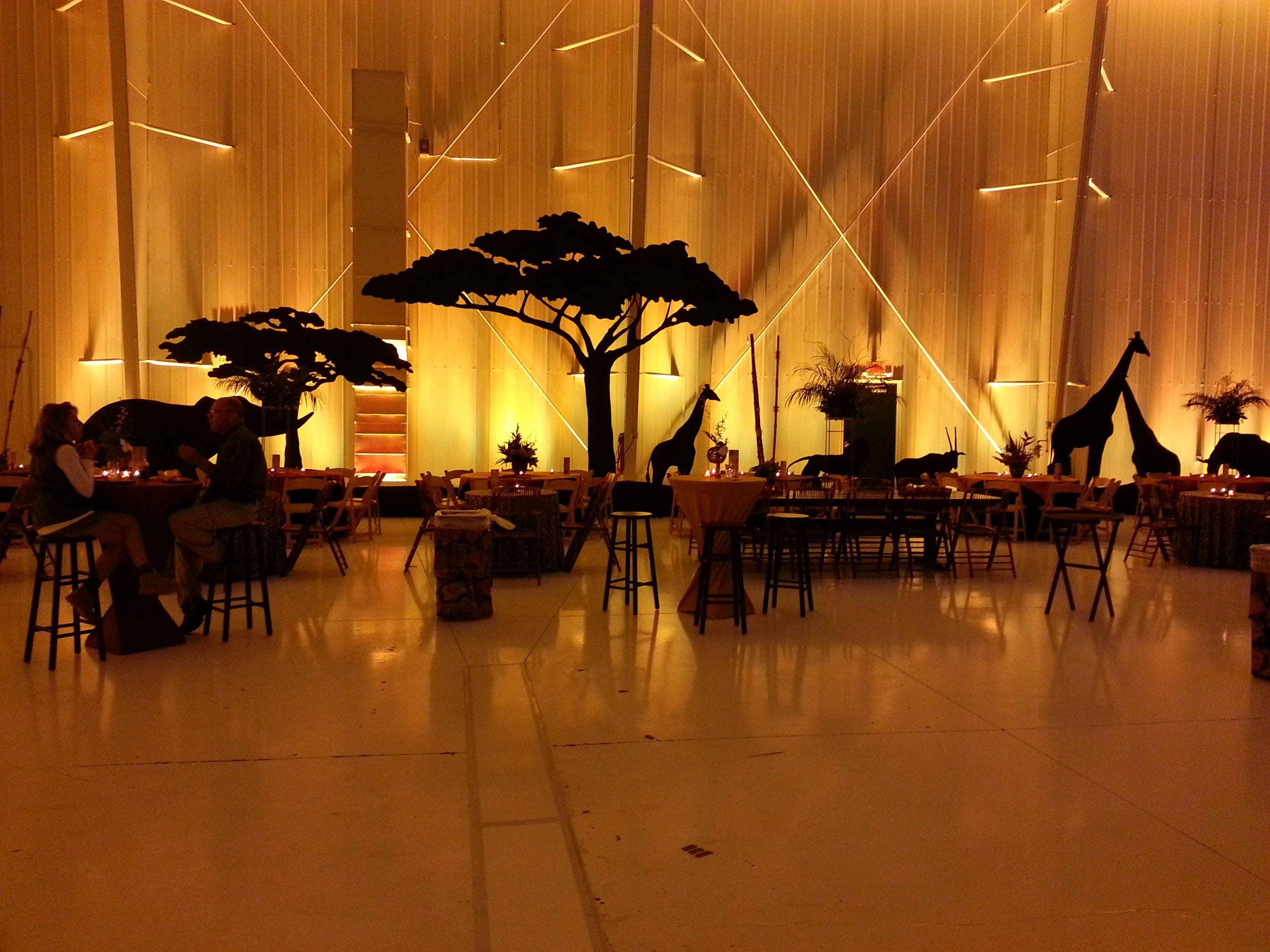 African Sahara themed party in an airport hanger. Decor by Event Lab, Lighting by Duluth Event Lighting.