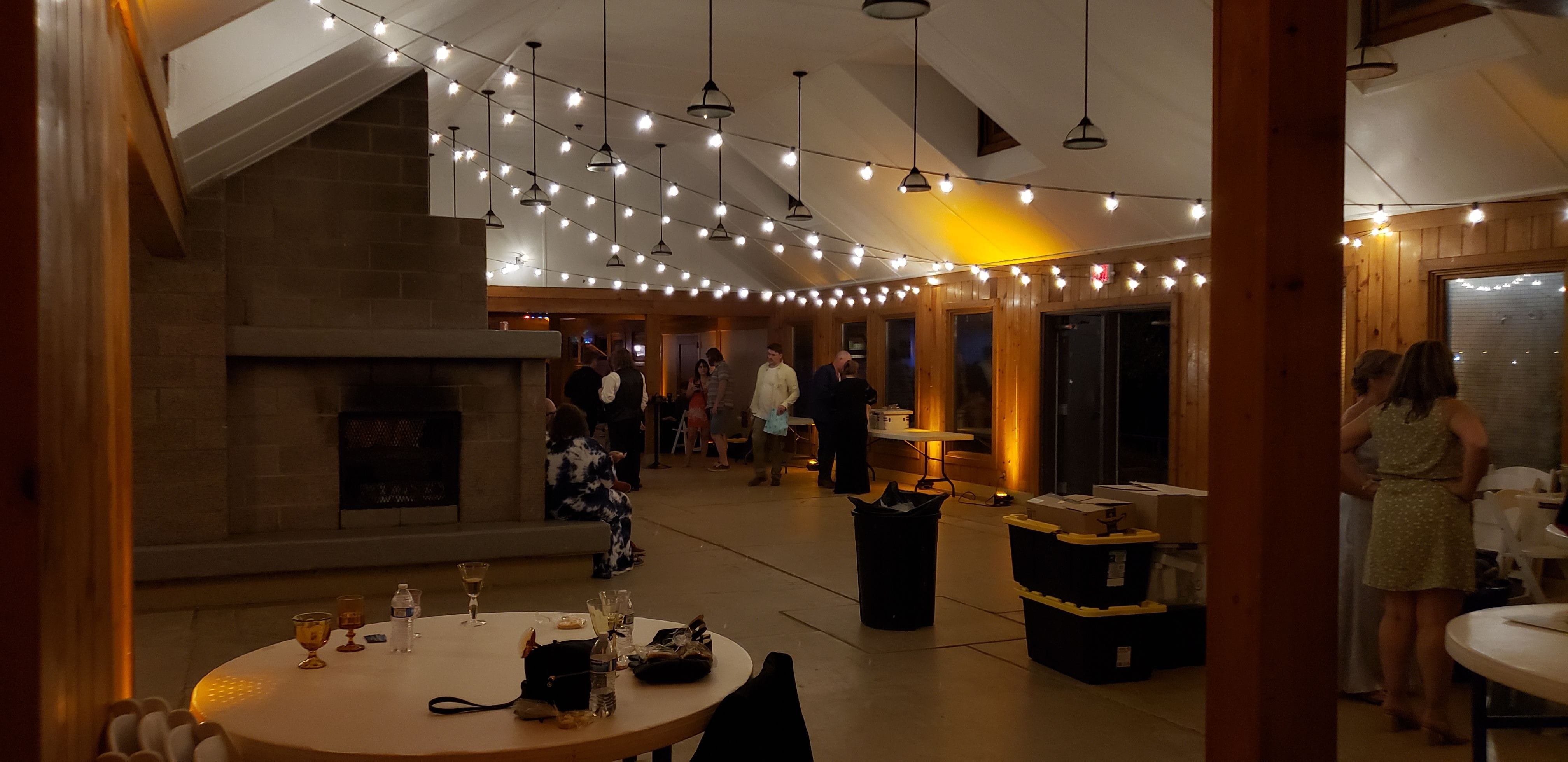 Park Point Beach House wedding lighting with bistro and amber up lighting by Duluth Event Lighting.