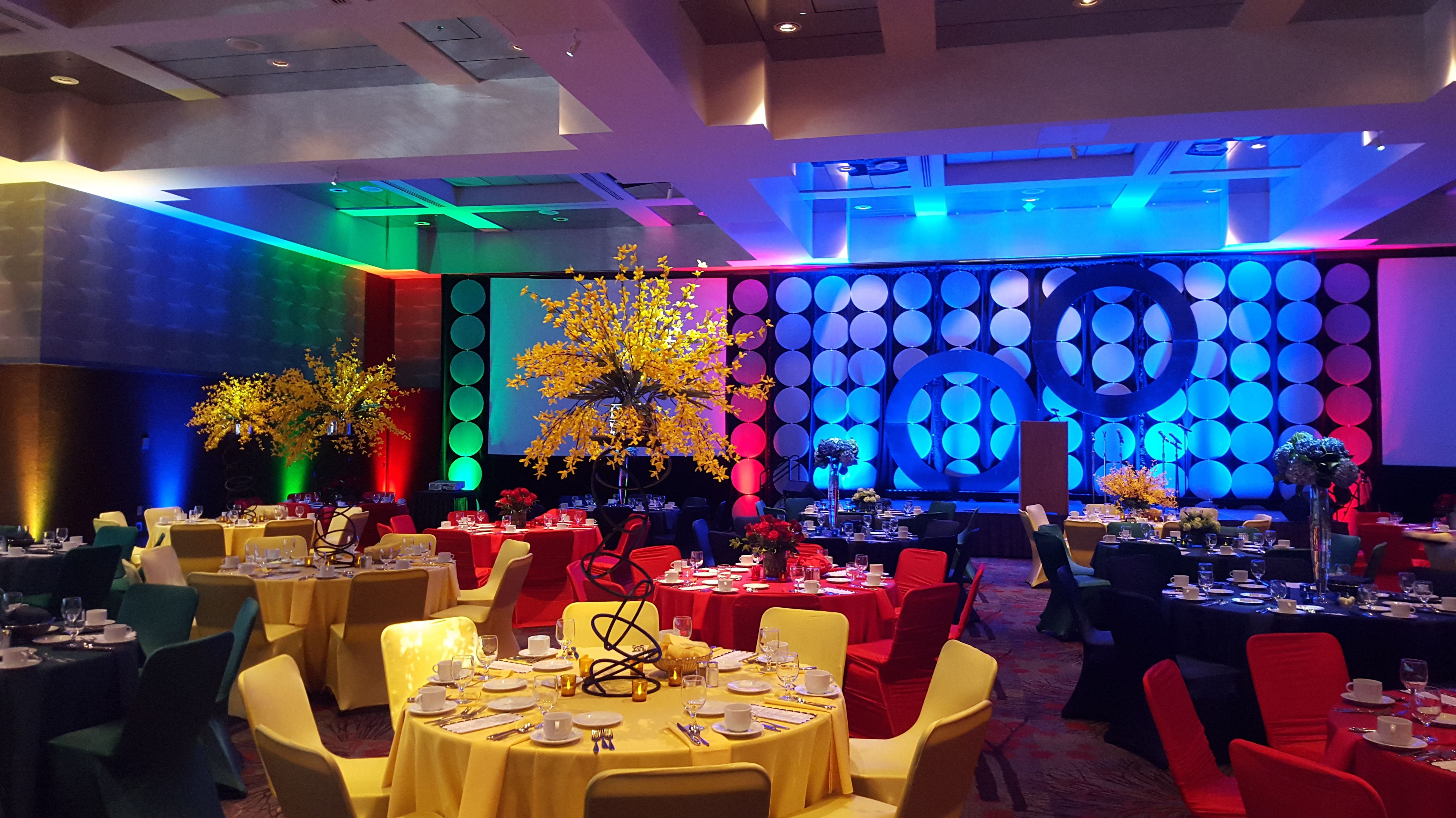 Event Lighting with a colorful stage backdrop.