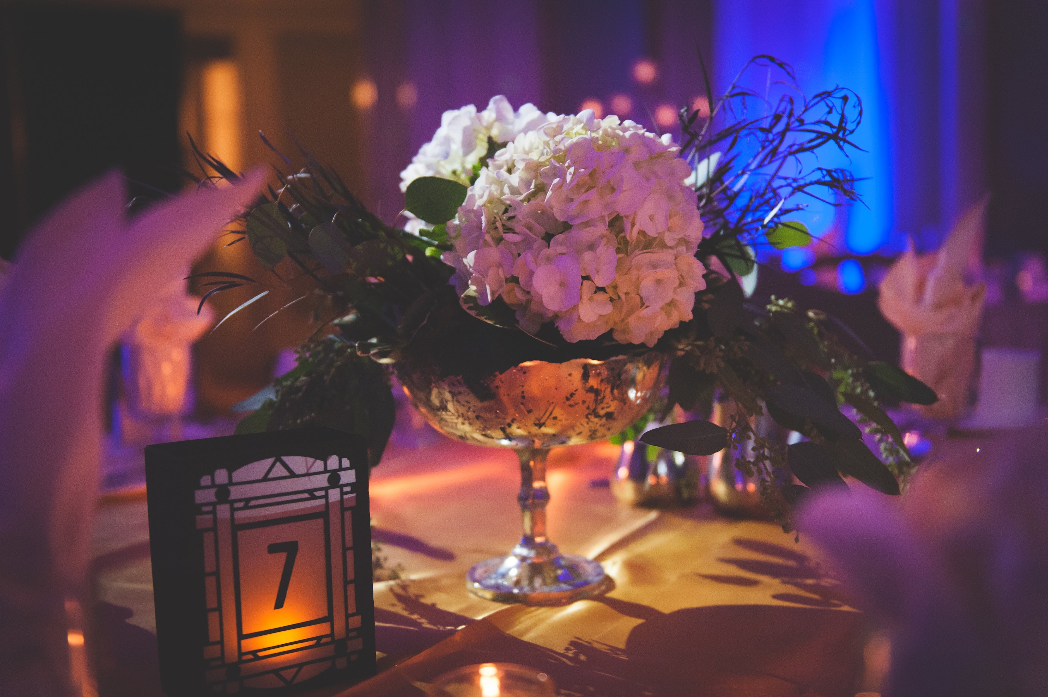 Greysolon Ballroom wedding with pin spots on the flowers. Photo by 3 Irish Photography.
