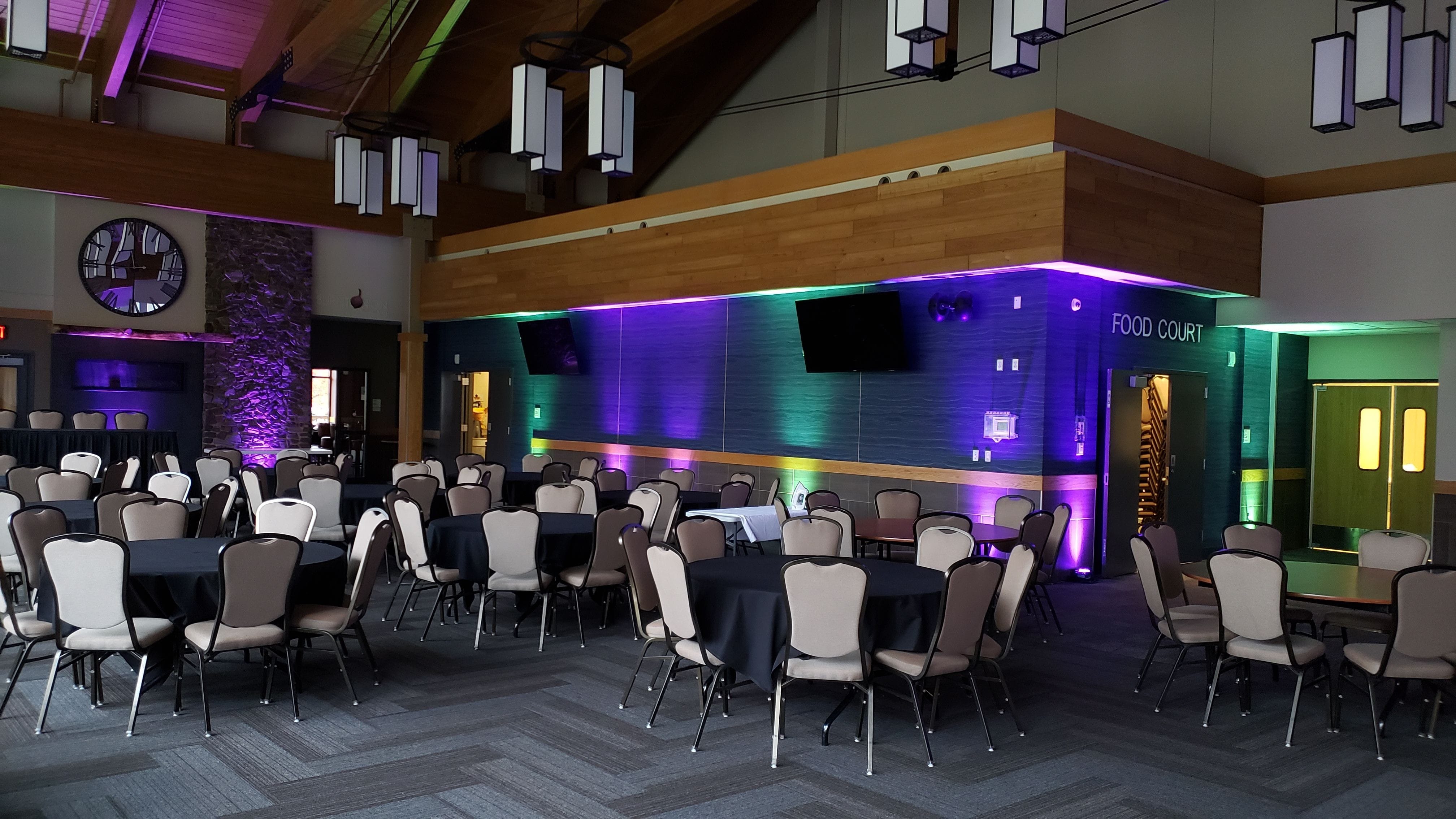 Wedding lighting at Giants Ridge with mint green and purple up lighting by Duluth Event Lighting.