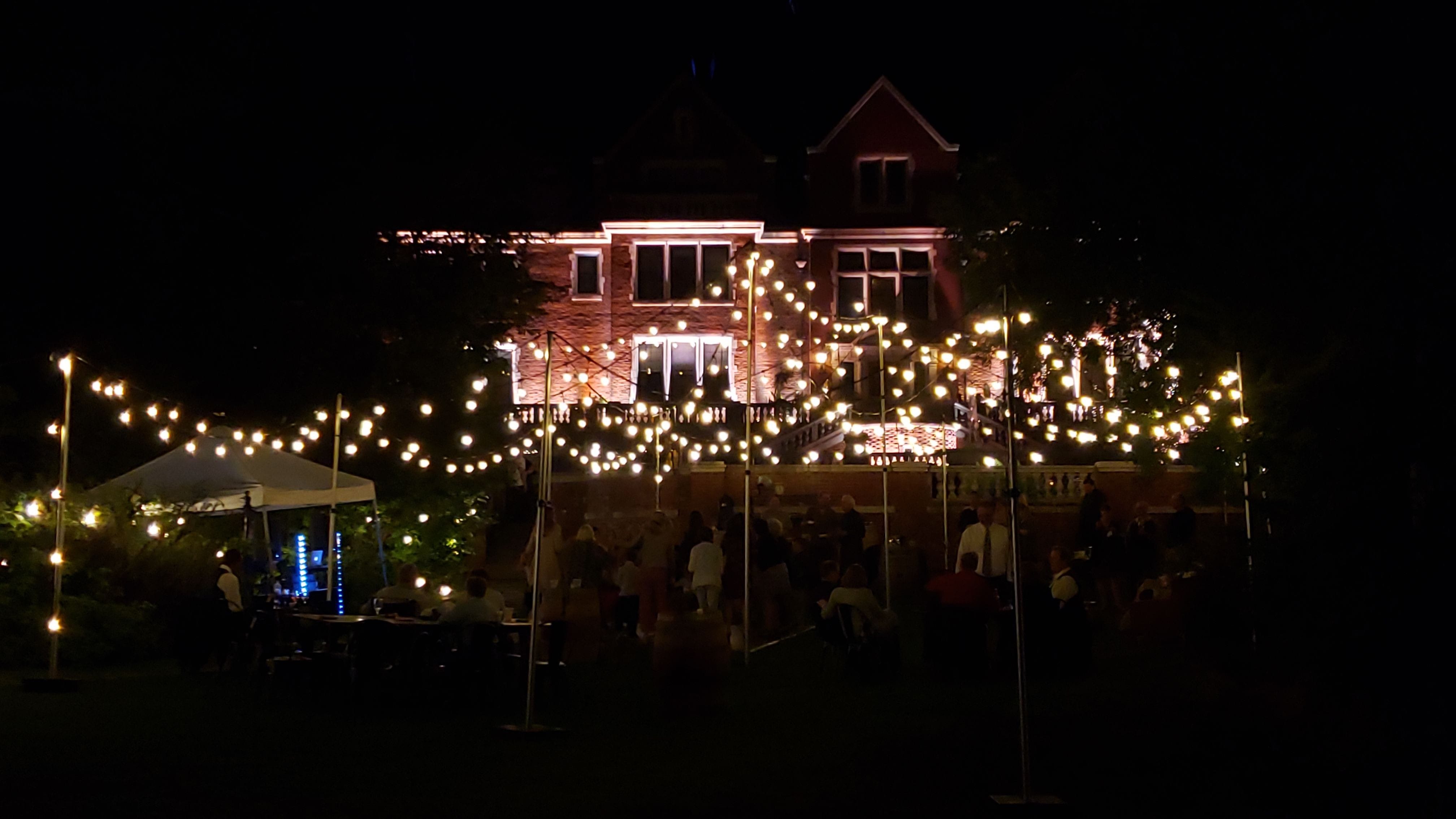 Wedding lighting at Glensheen with a tent bistro provided by Duluth Event Lighting,