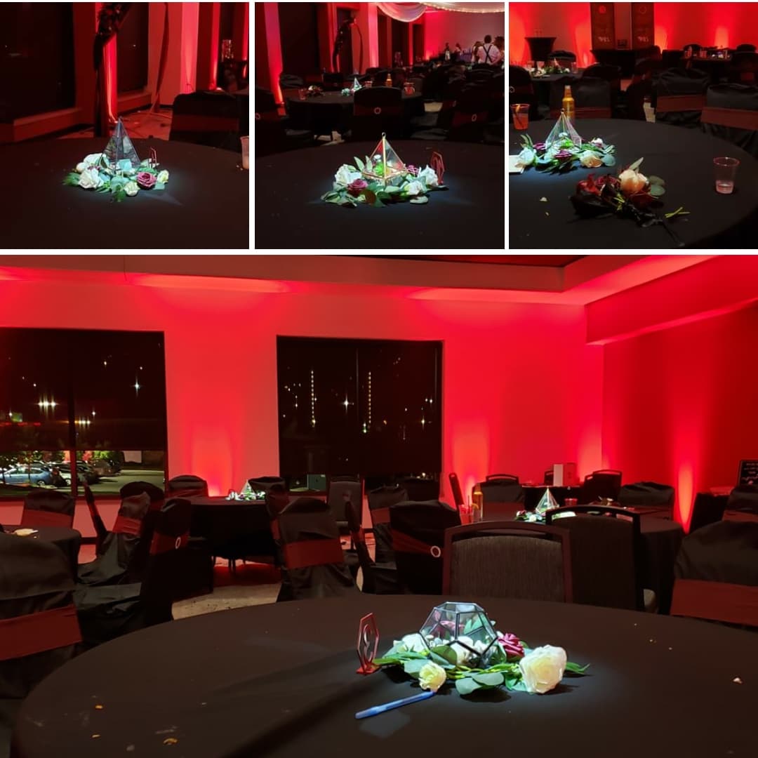 Pier B wedding lighting in red up lighting and pin spots by Duluth Event Lighting.