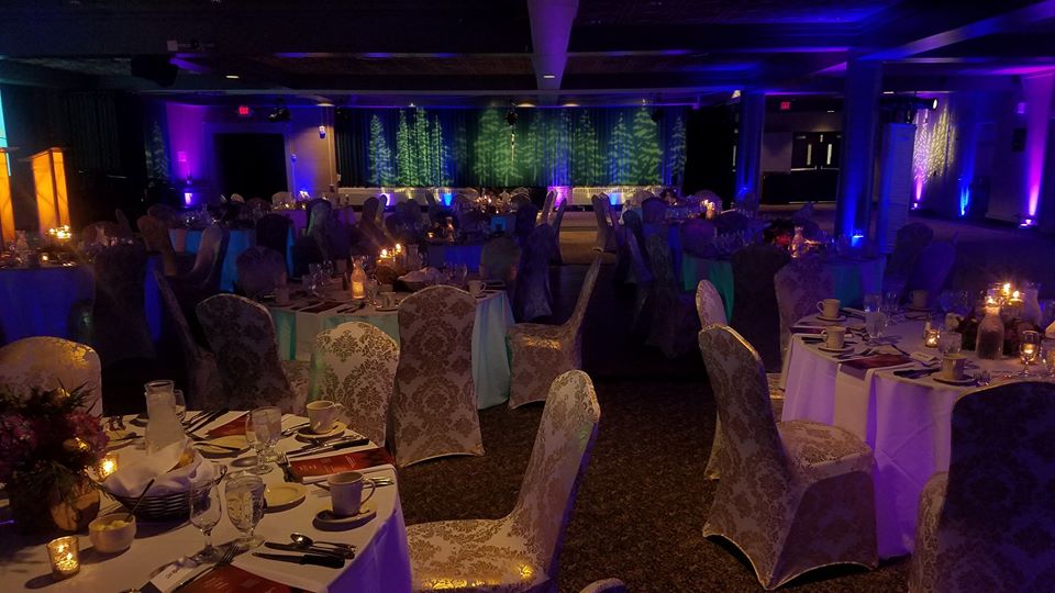 Northern Lights theme.
Up lighting in blues and purples with pine tree gobos. Decor by Northland Special Events.
