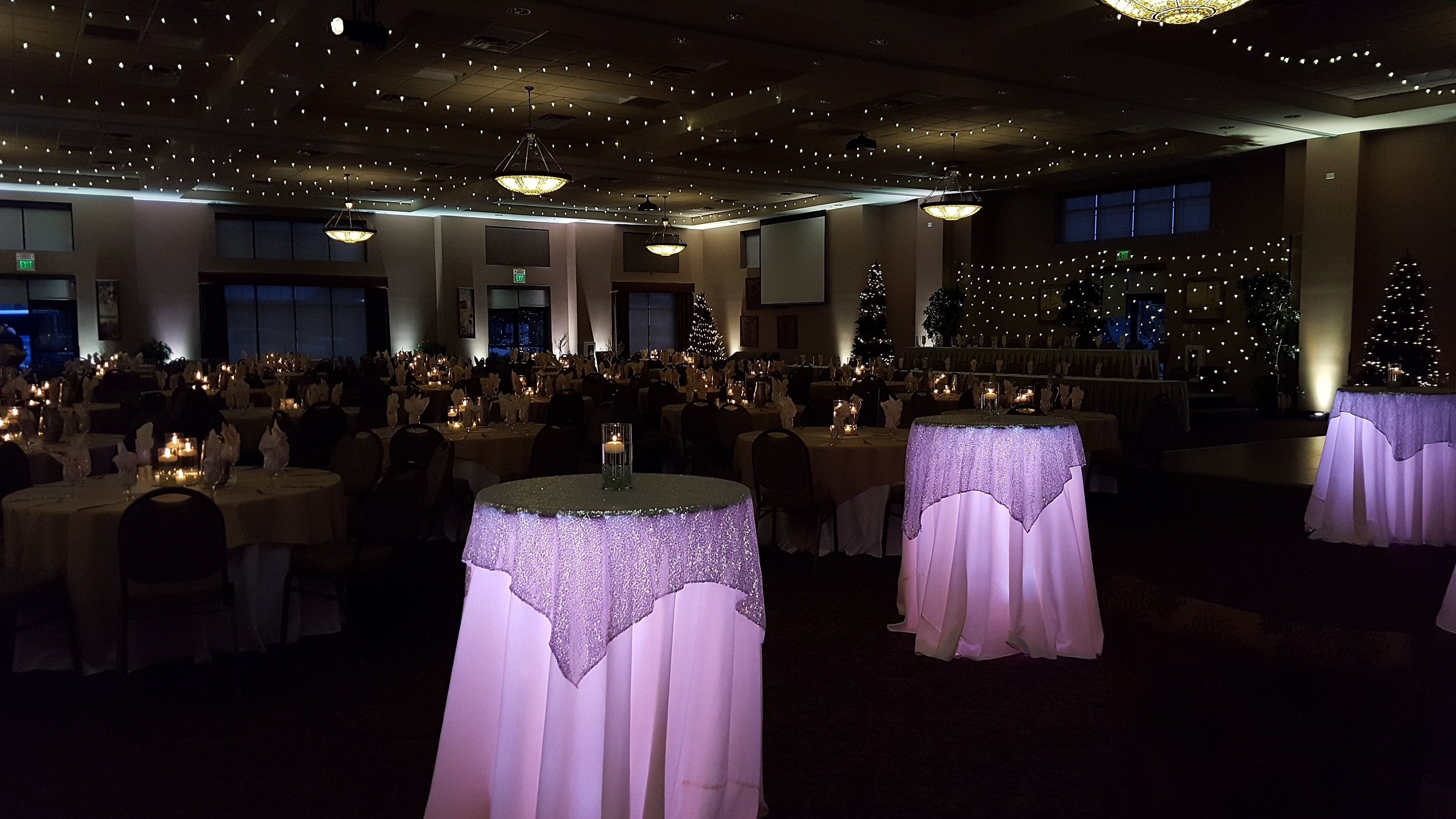 Timberlake Lodge, Grand Rapids. Wedding lighting in champagne white. Glowing Cocktail tables, wedding monogram, bistro