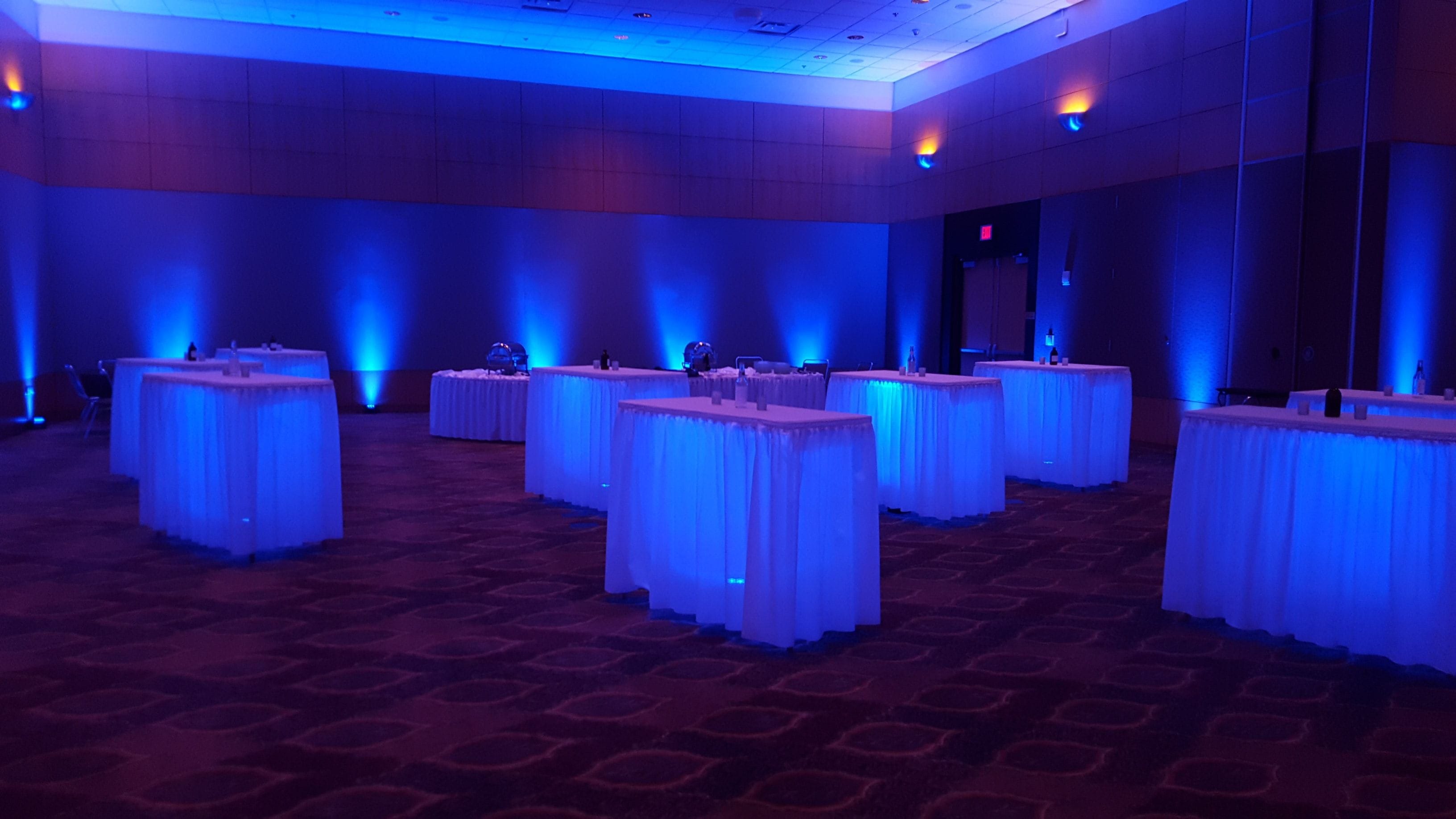 DECC Horizon Room,
Blue up lighting with glowing cocktail tables