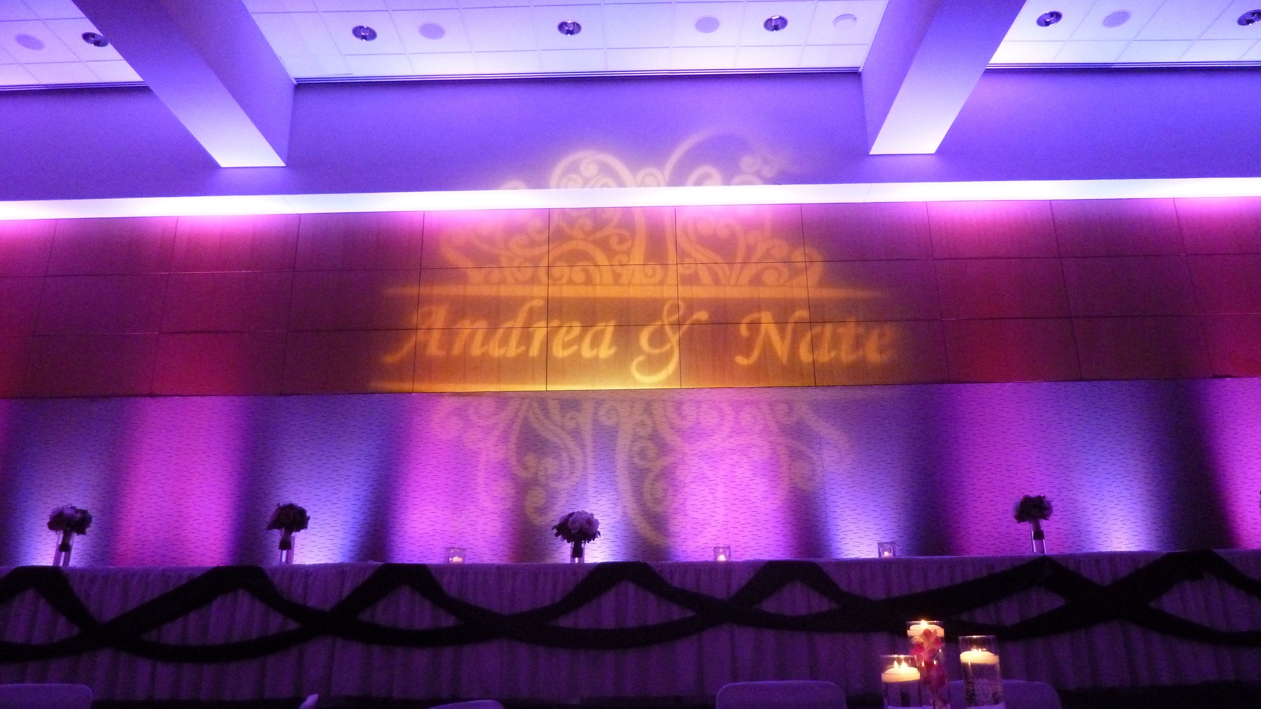 DECC Harbor Side Ballroom. Wedding lighting in two tone lavender with wedding monogram.