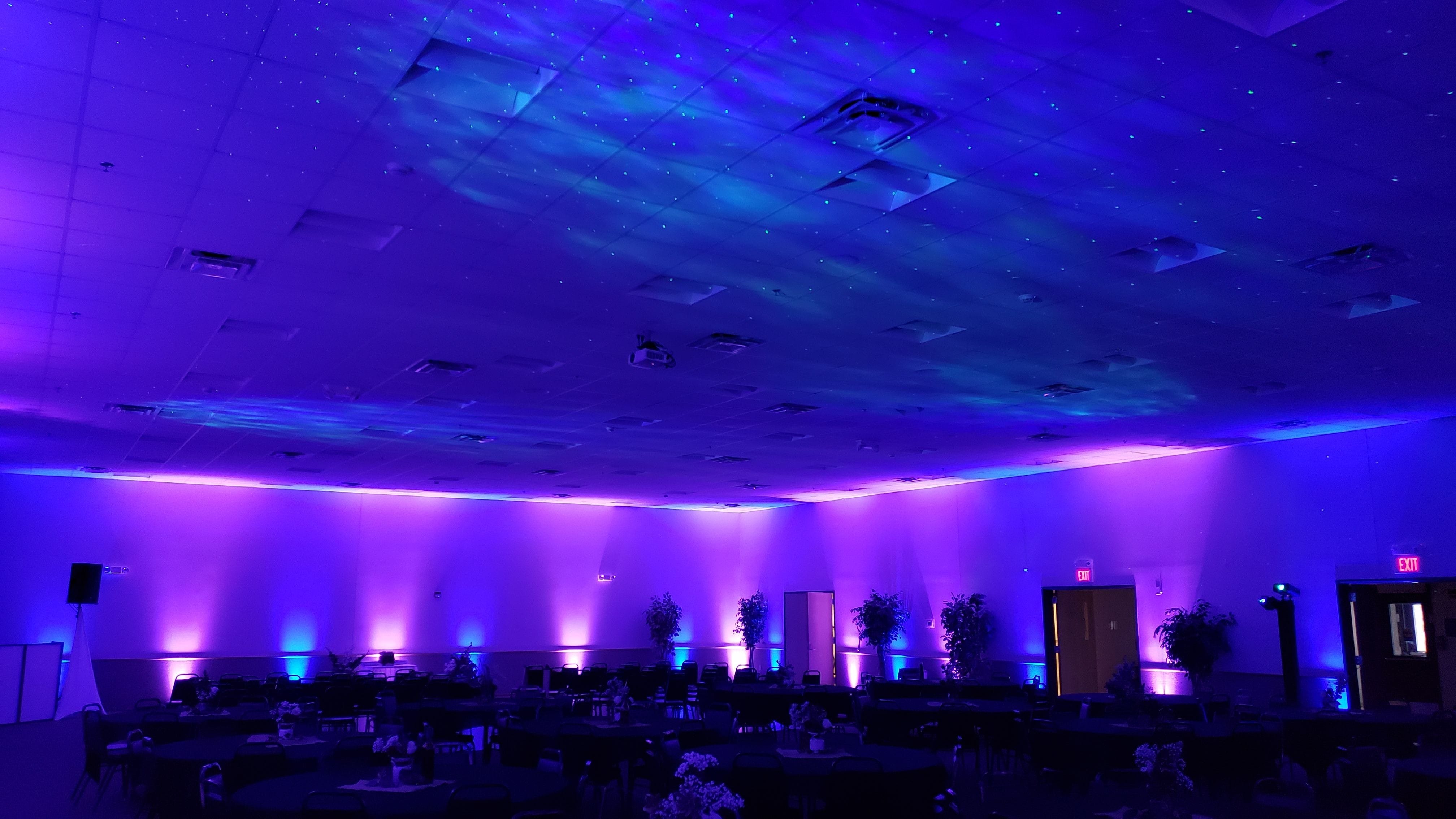 Wedding lighting at the AAD Shrine by Duluth Event lighting.Up lighting in lavender and blue with northern lights on the ceiling