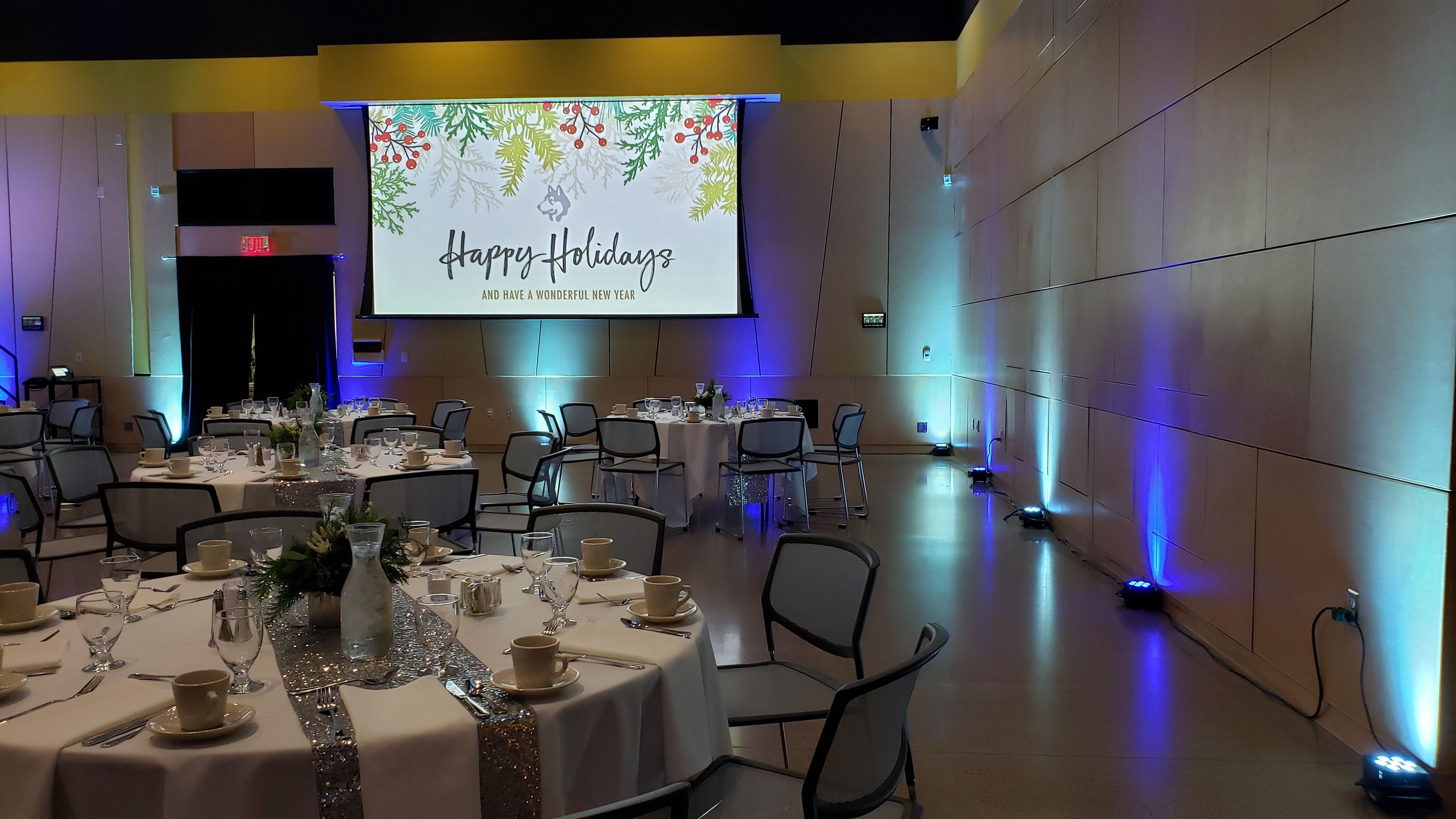 Holiday Party at UWS with blue and ice blue up lighting.