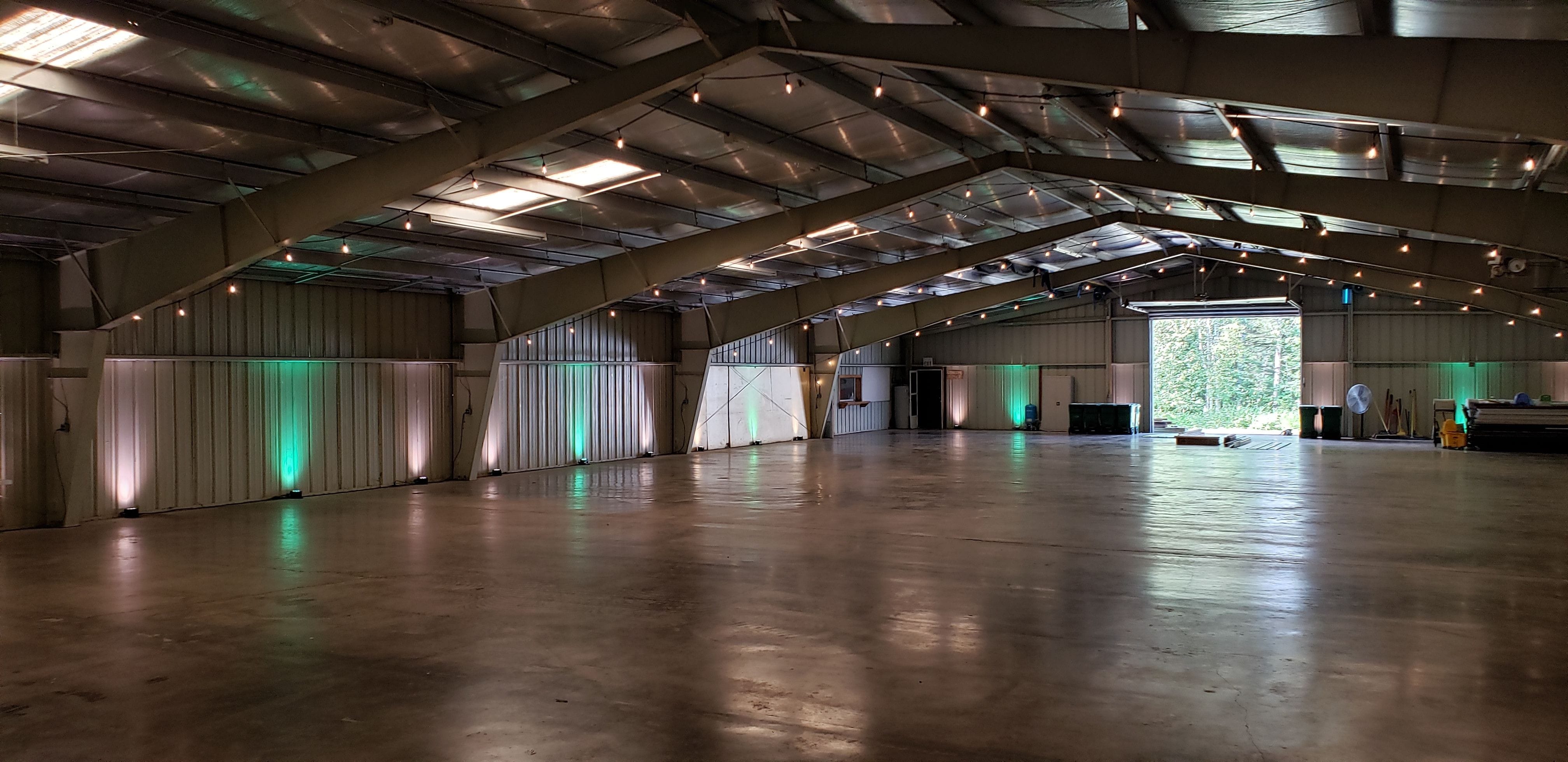 Wedding lighting at the Lake County Fairgrounds. Up lighting in mint green and soft white by Duluth Event Lighting.