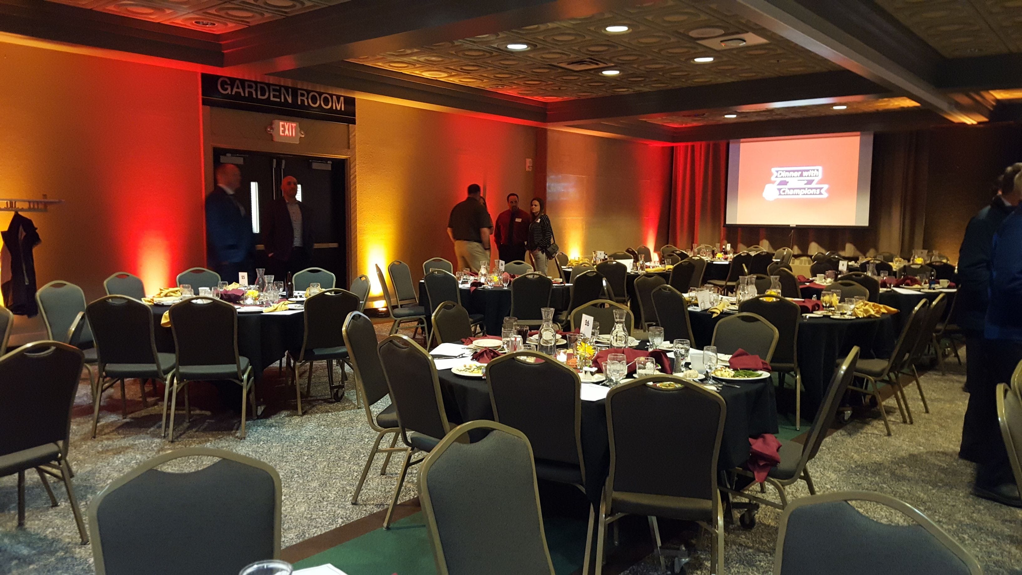UMD event. Up lighting in a dim red and a gold for school colors.