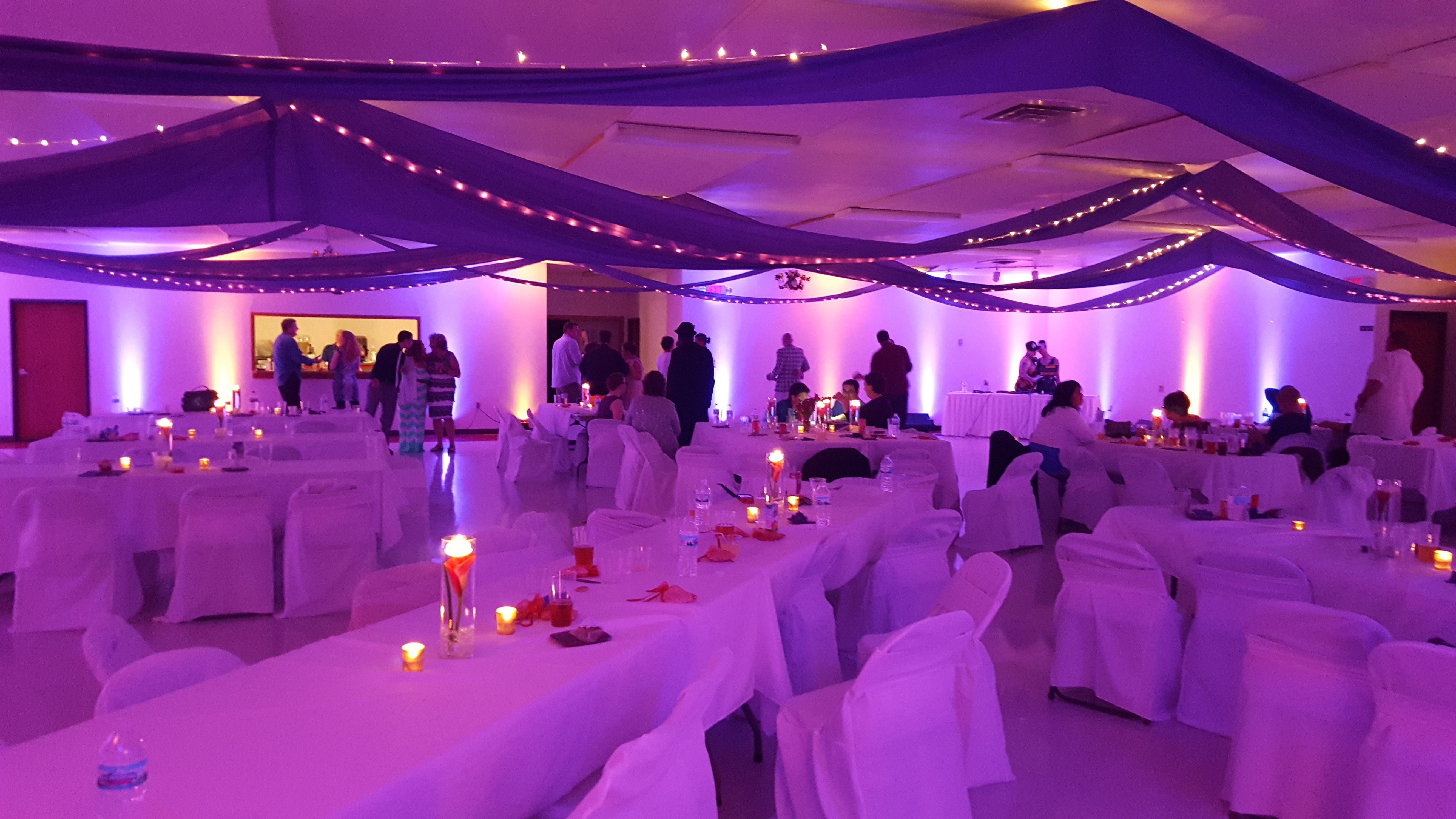 Billings Park wedding lighting with purple and orange up lighting by Duluth Event Lighting.