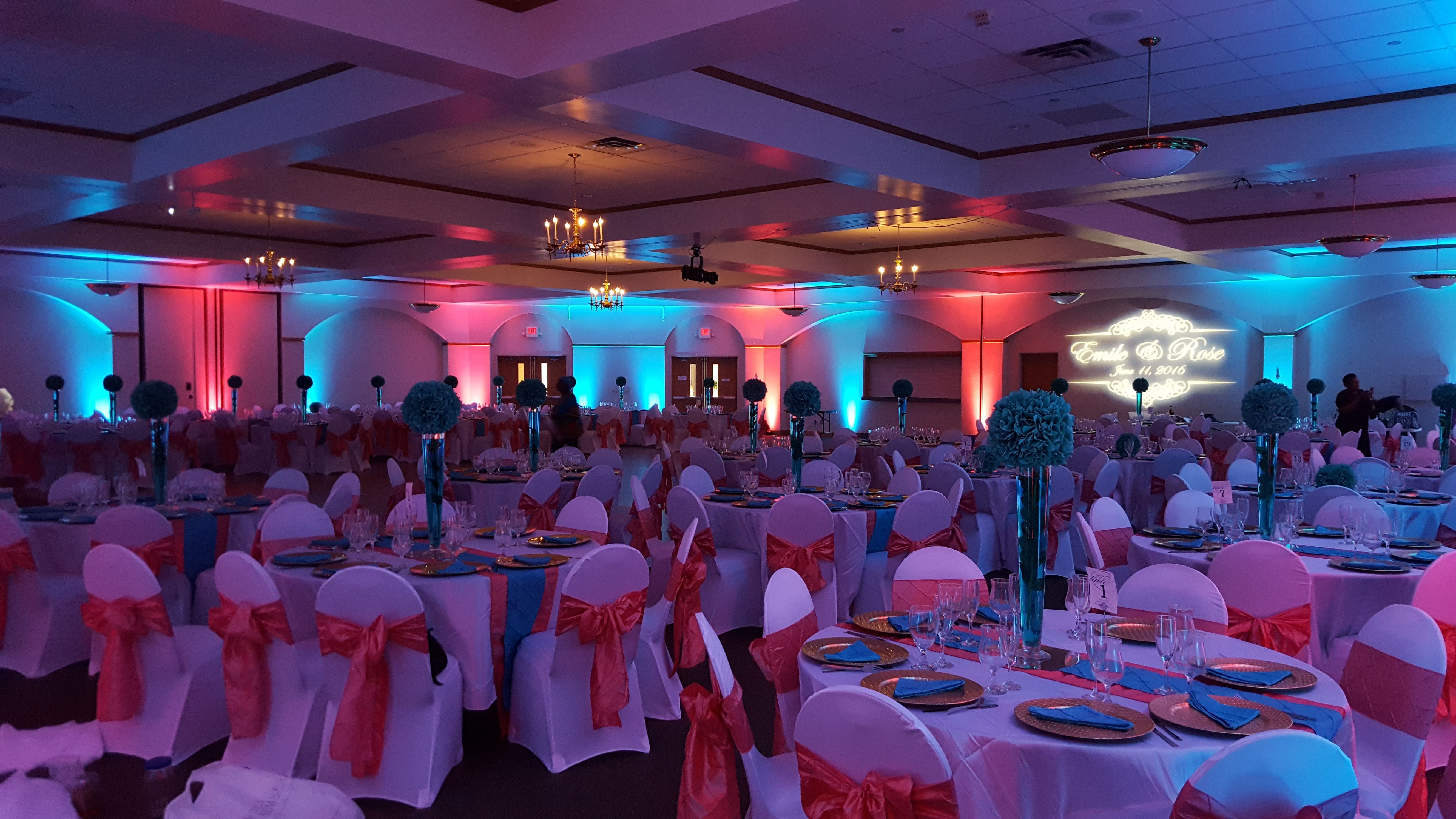Teal and Coral wedding lighting at the Cedars Hall