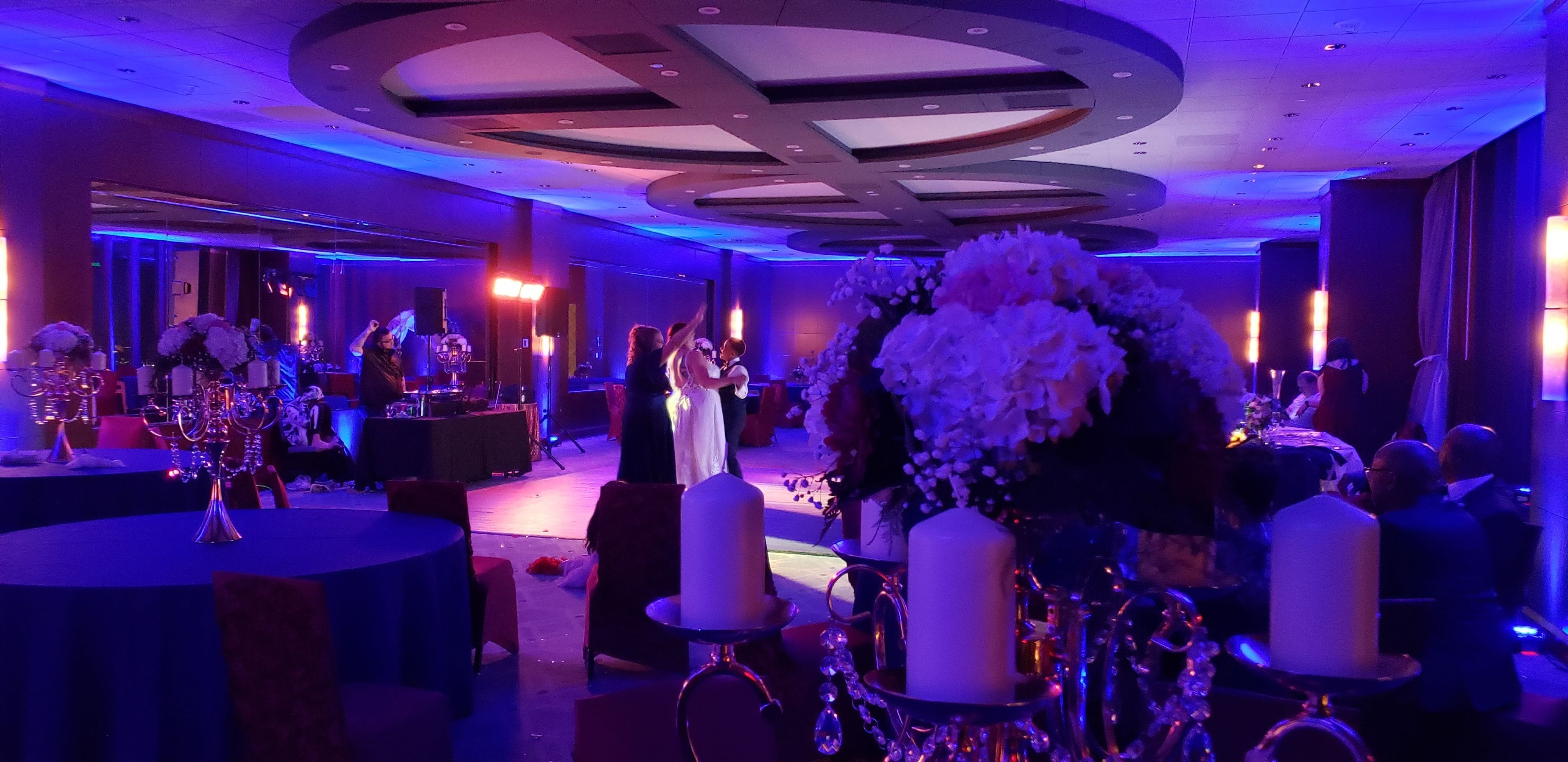 Wedding lighting at Windows on Minnesota. Up lighting in blue by Duluth Event Lighting.