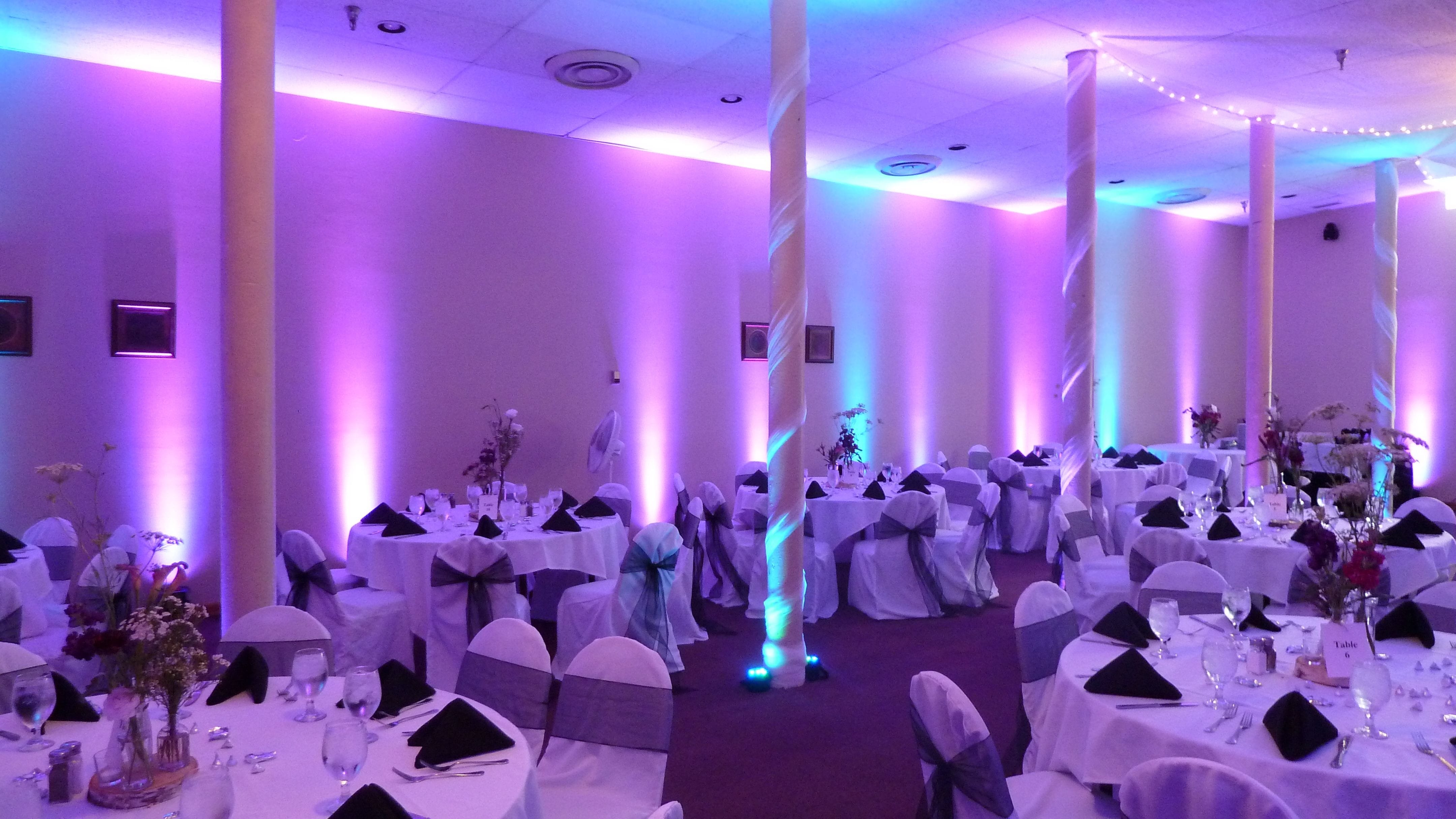 Wedding lighting in the August Fitger room. Up lighting in teal and purple.