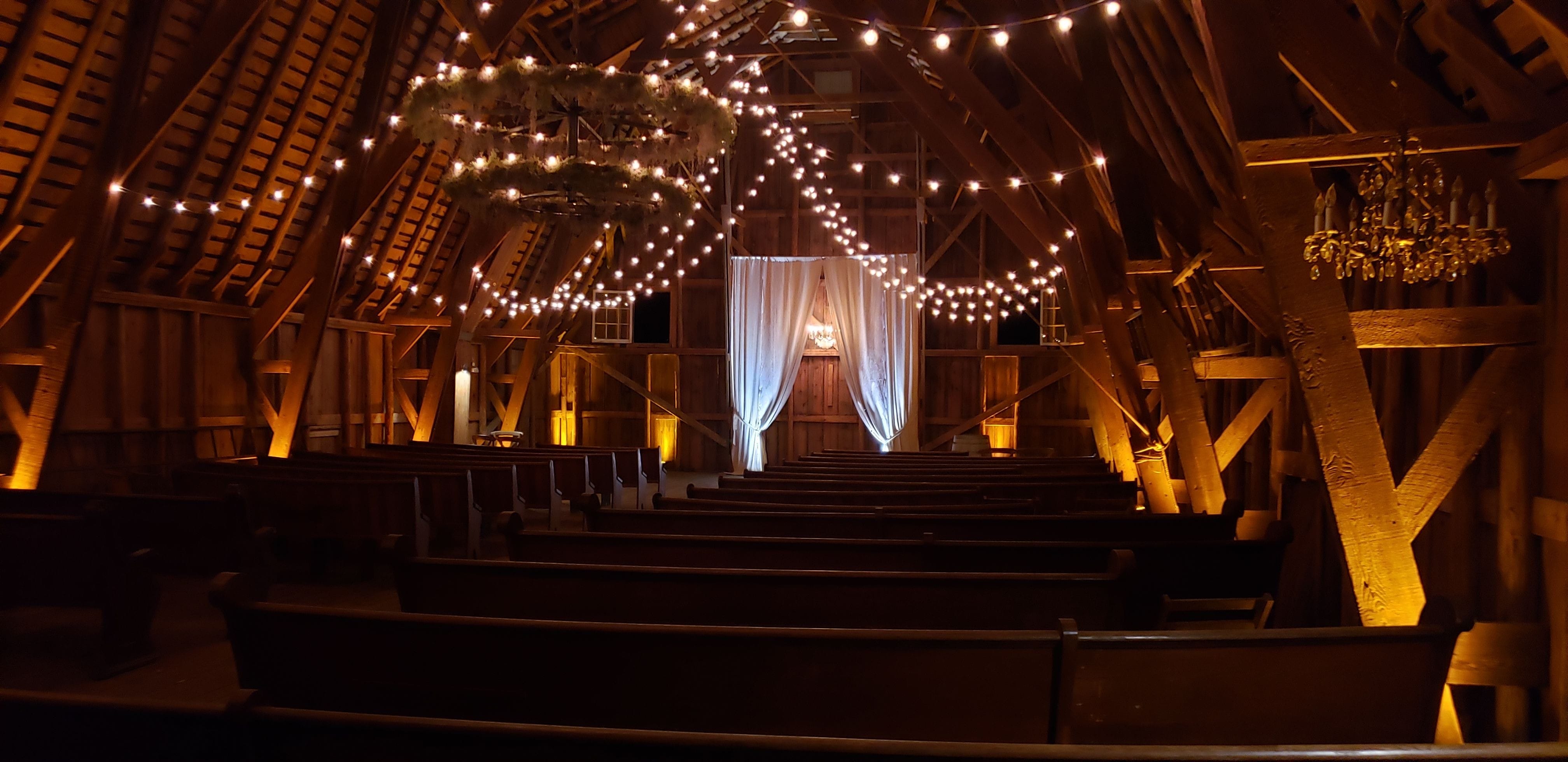 Amber up lighting in the wedding barn of The Grainary by Duluth Event Lighting