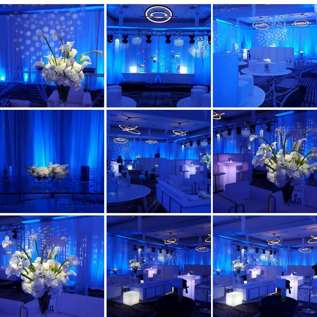 Event lighting by Duluth Event Lighting. up lighting in blue with pin spots on the flowers.
