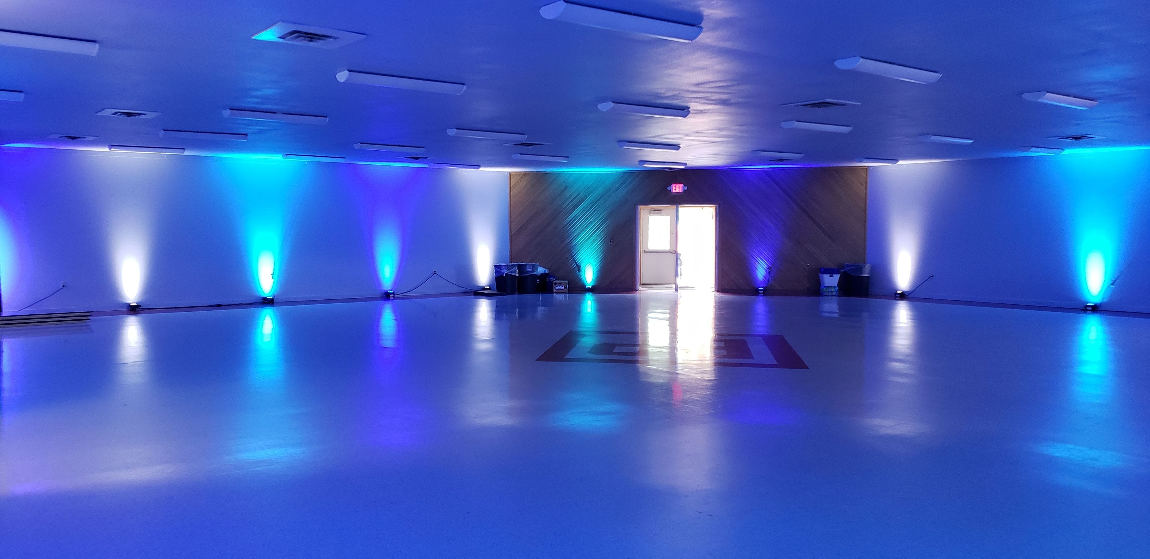 A Billings Park Civic Center wedding with two tone blueup lighting by Duluth Event Lighting