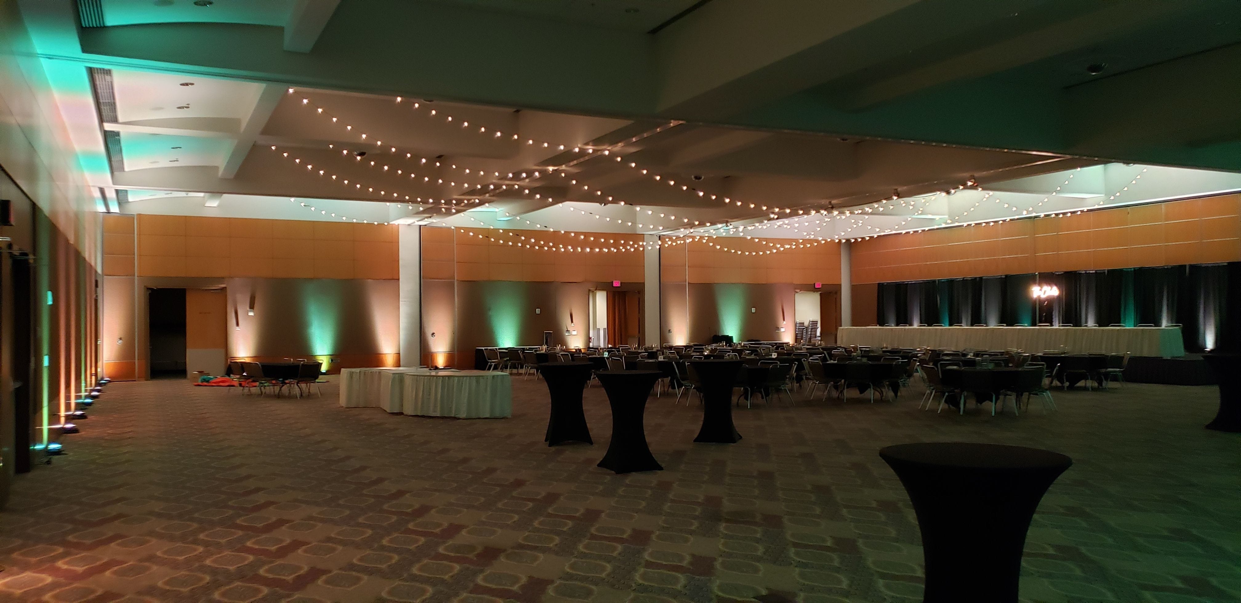 Wedding lighting in the Harbor Side Ballroom at the DECC. Up lighting in mint green and white with bistro by Duluth Event Lighting.