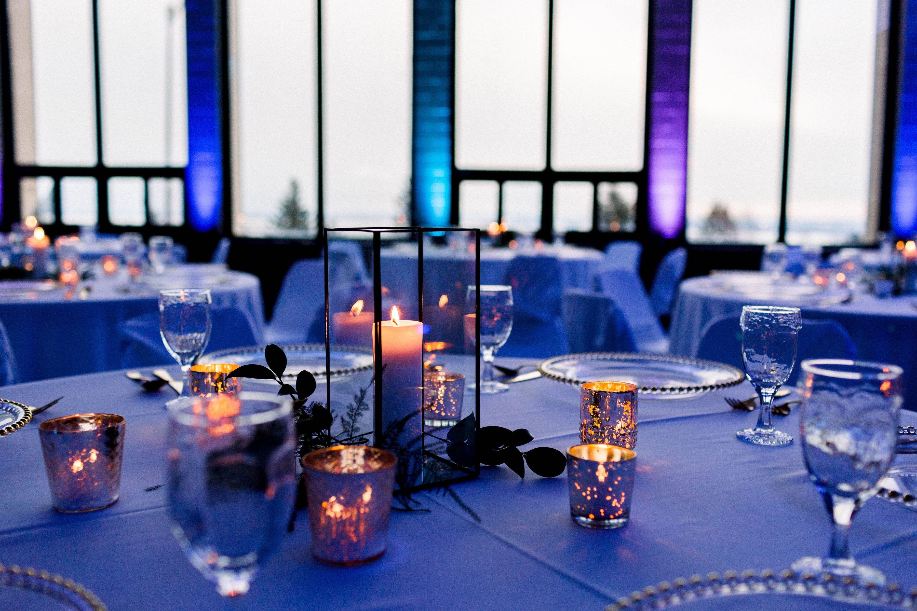 Photo by Marya Juliann Photography. Northern Lights up lighting theme in blue, teal and purple.  Decor by Pure Event Planning & Design.