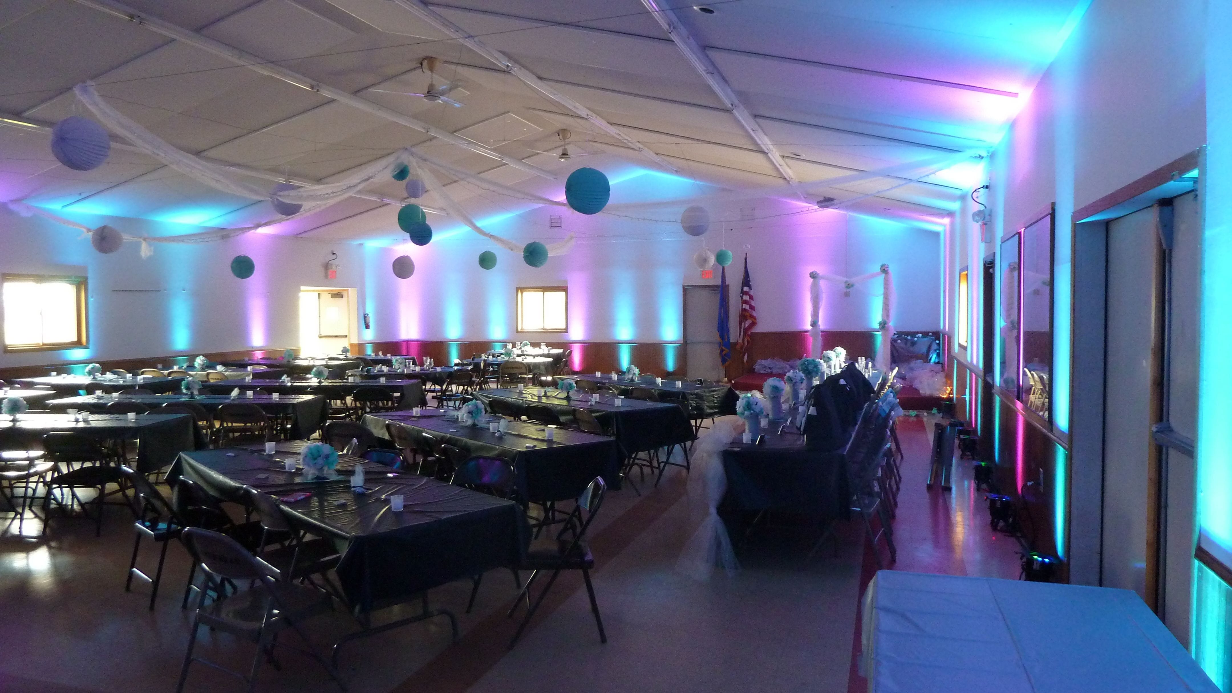 Wedding lighting in teal and magenta.
