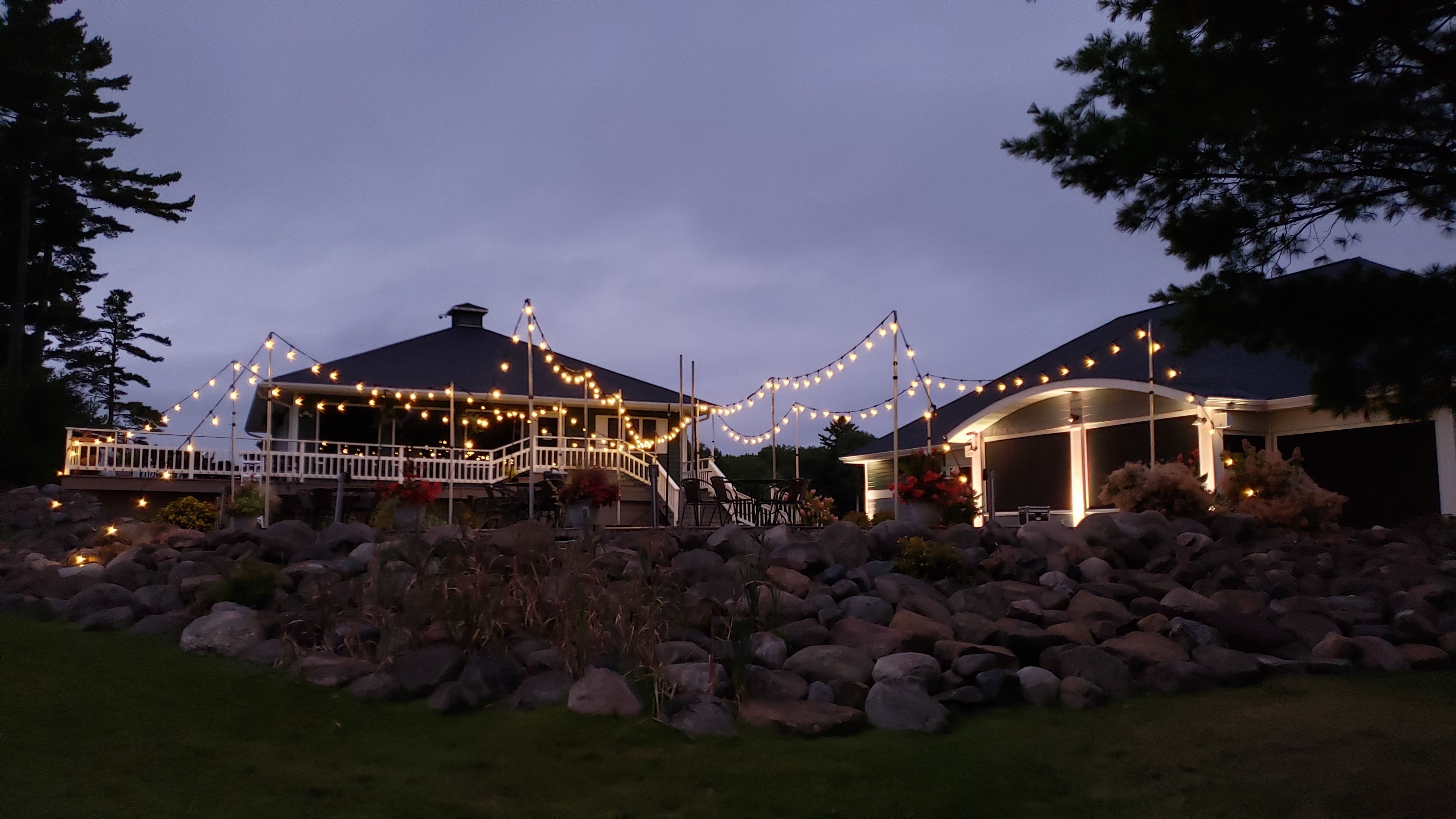 wedding lighting in Bayfield with bistro on the patio of the Apostle Highland Golf Course