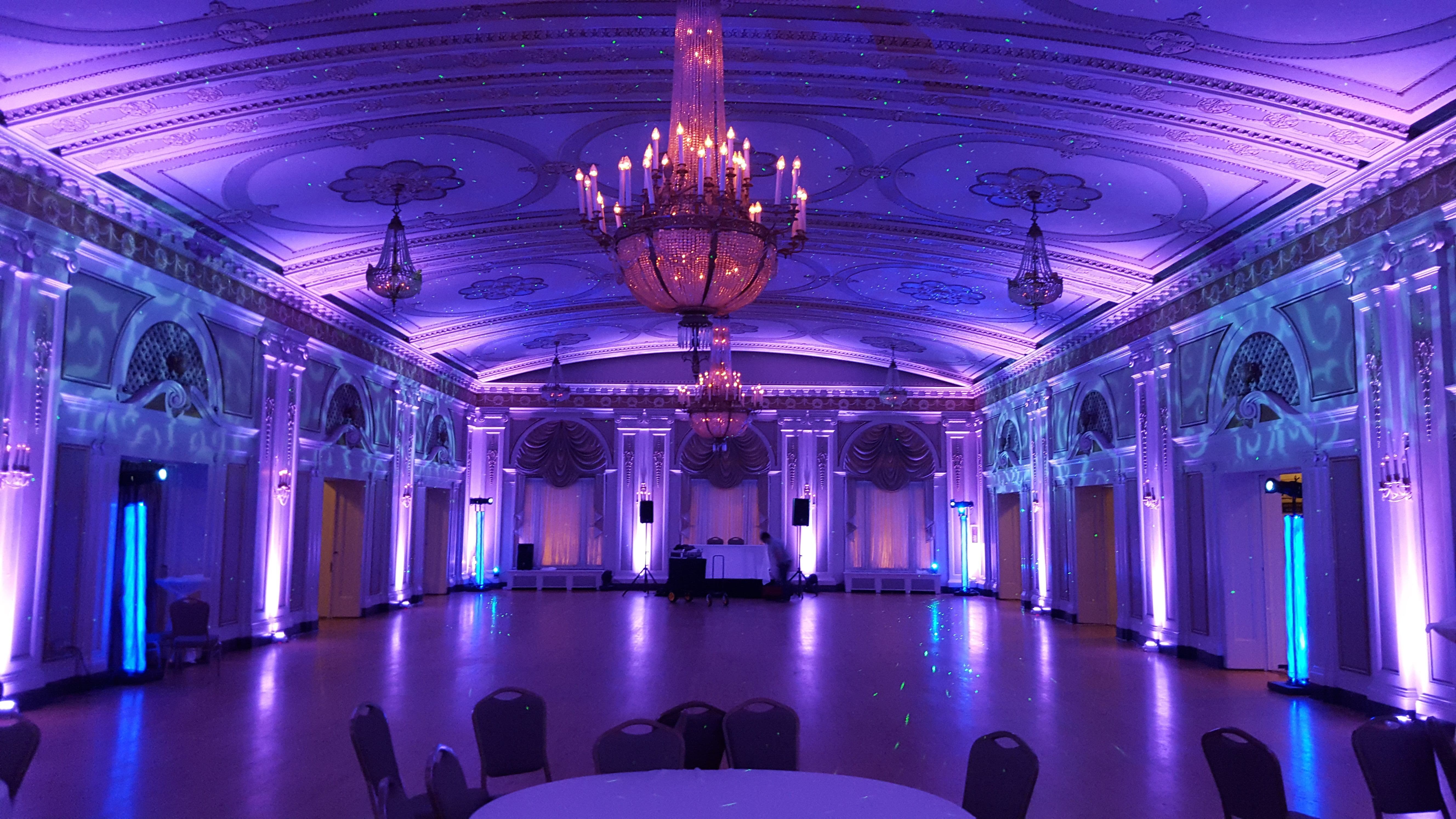 Wedding lighting at Greysolon Ballroom. Up lighting in lavender with stars and Northern Lights dancing on the ceiling.