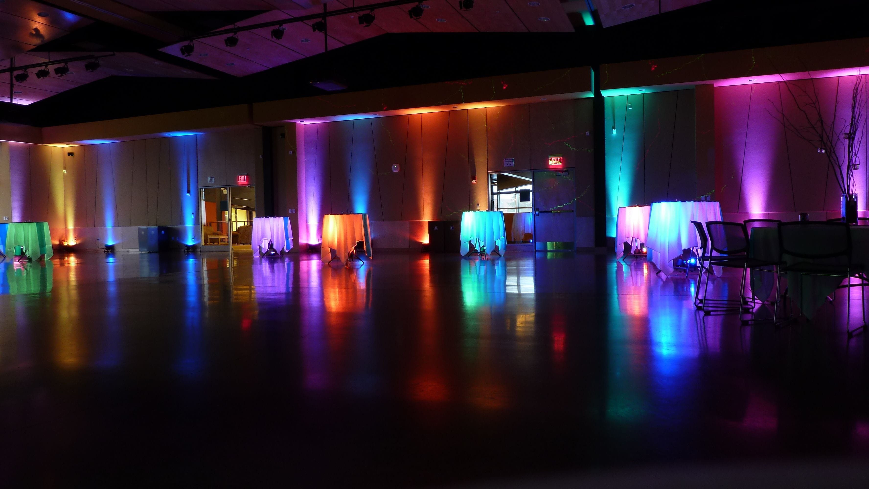 A prom at Yellowjacket Union. Up lighting in a rainbow of colors.