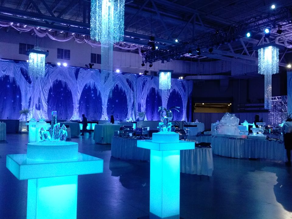 A fire and Ice themed party. Ice side of the room with glowing cocktail tables. Decor by Event Lab