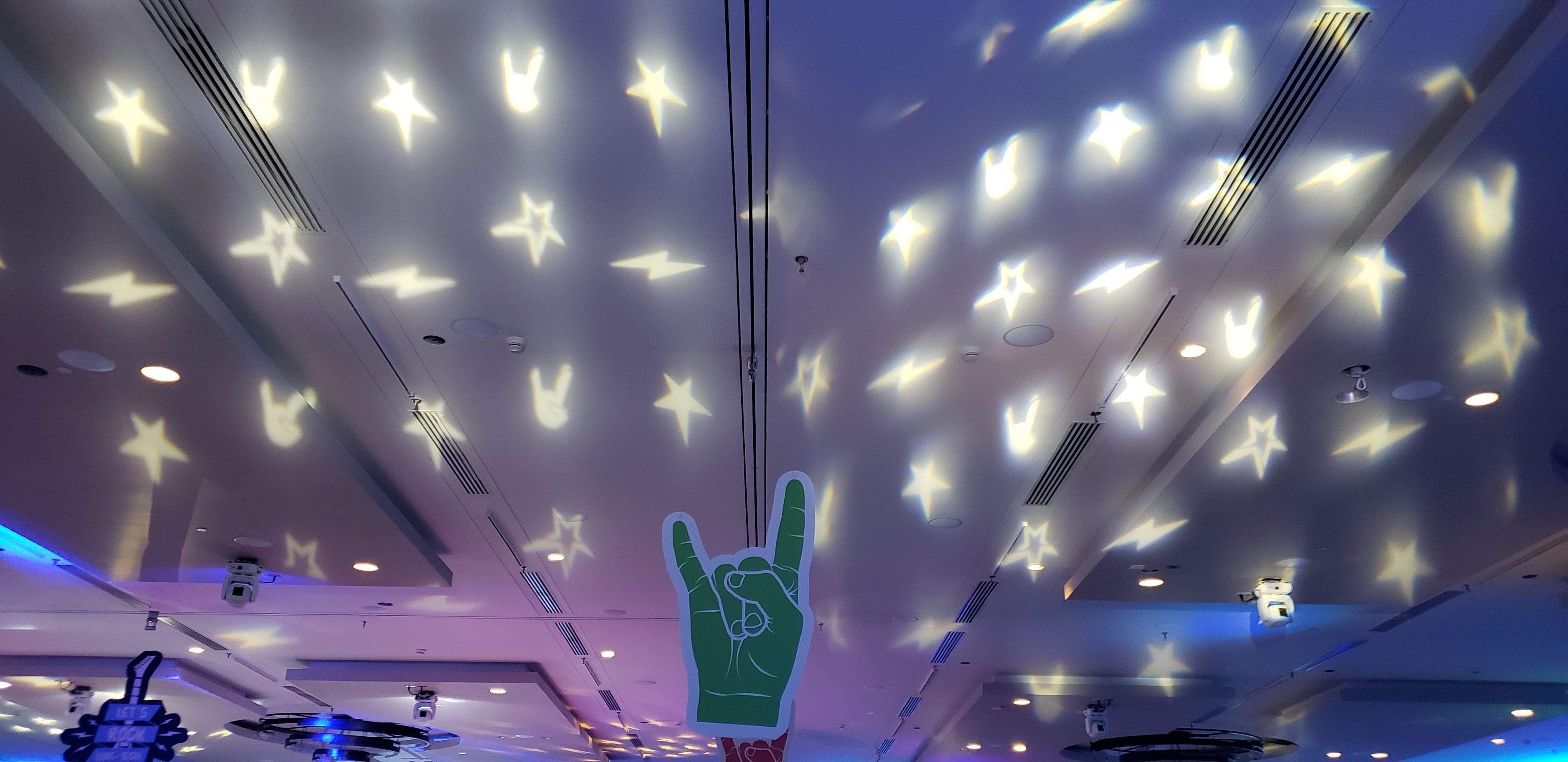 a Let's Rock themed break up pattern projection on the ceiling.