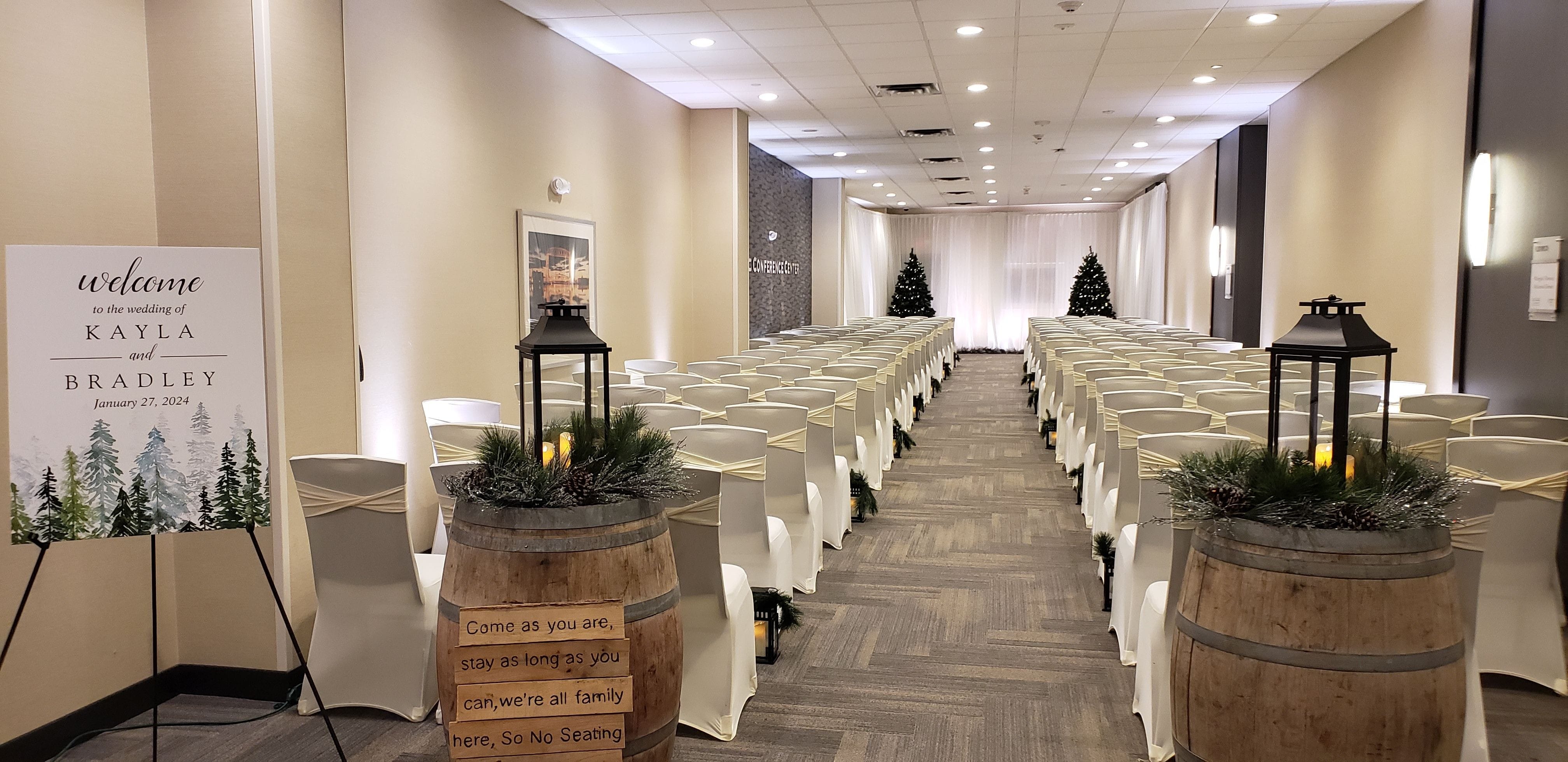 Wedding lighting in the Lyric Center at the Holiday Inn. Up lighting in white for the ceremony by Duluth Event Lighting.