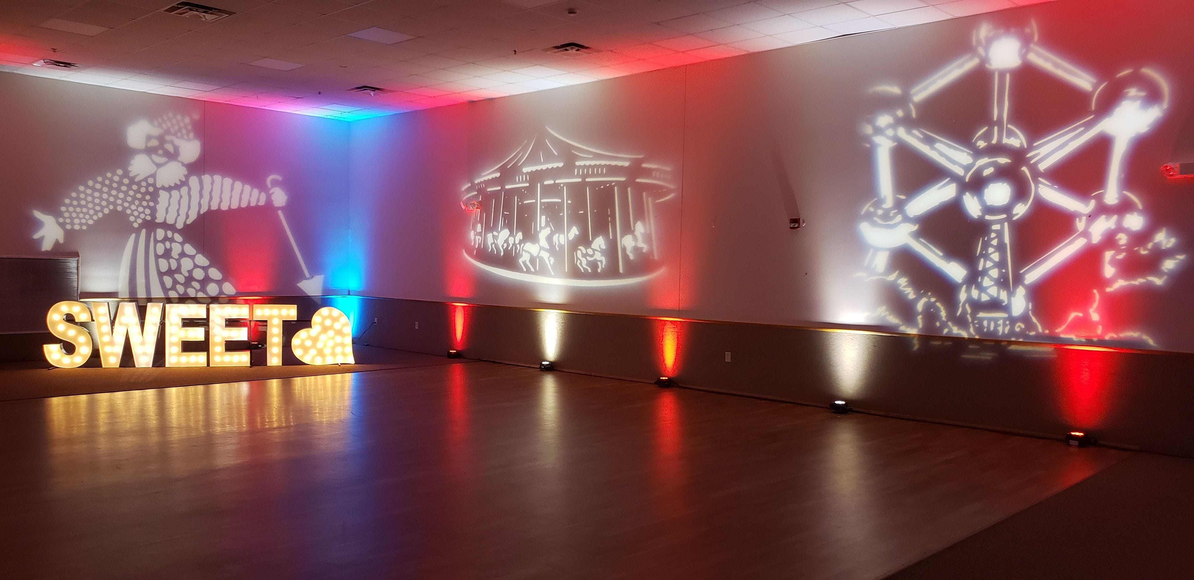 Under the Big Top themed party at the AAD Shrine with up lighting and gobo projections.