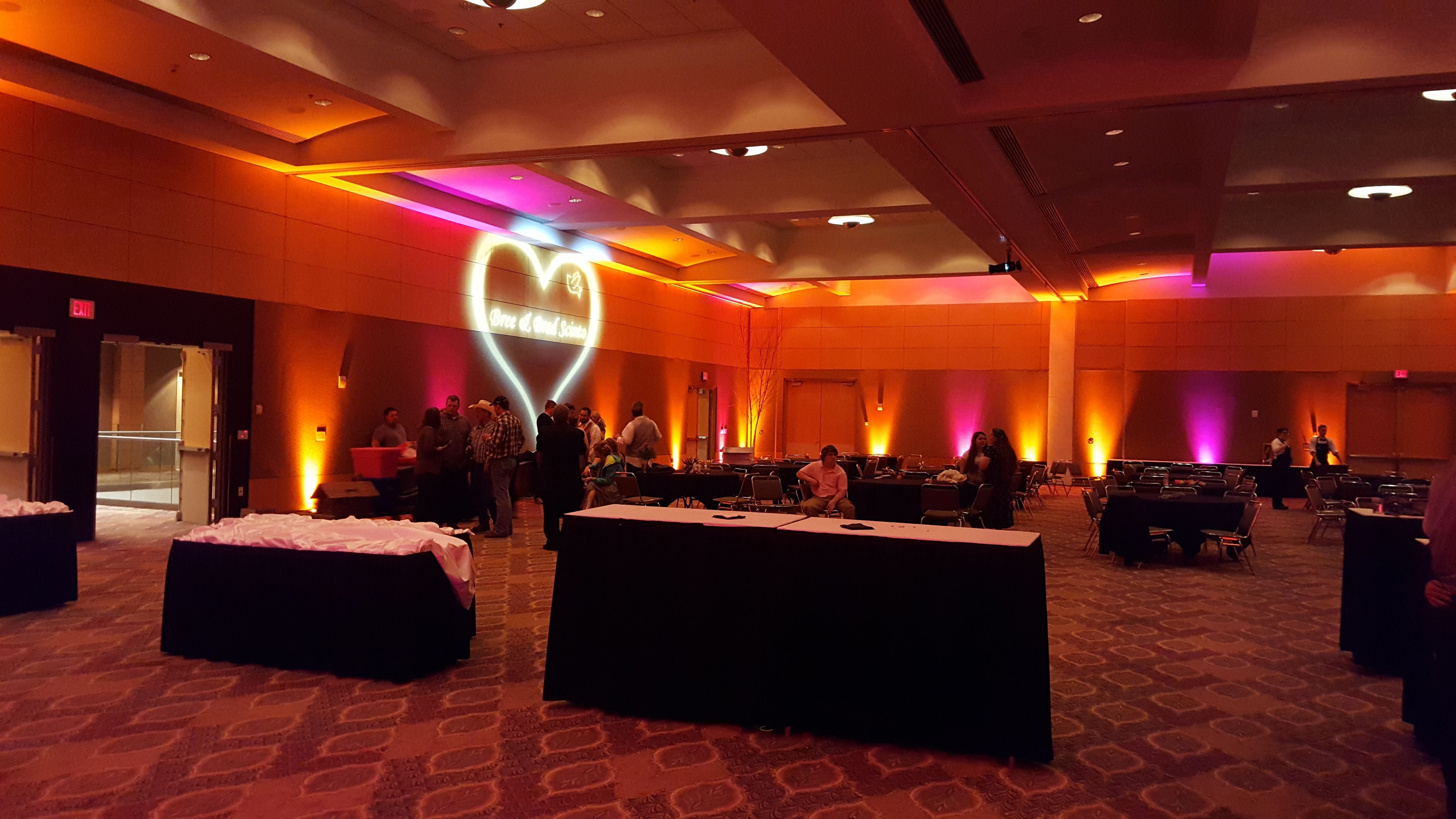 Harbor Side Ballroom, DECC.
Wedding lighting in pink and orange with wedding monogram.