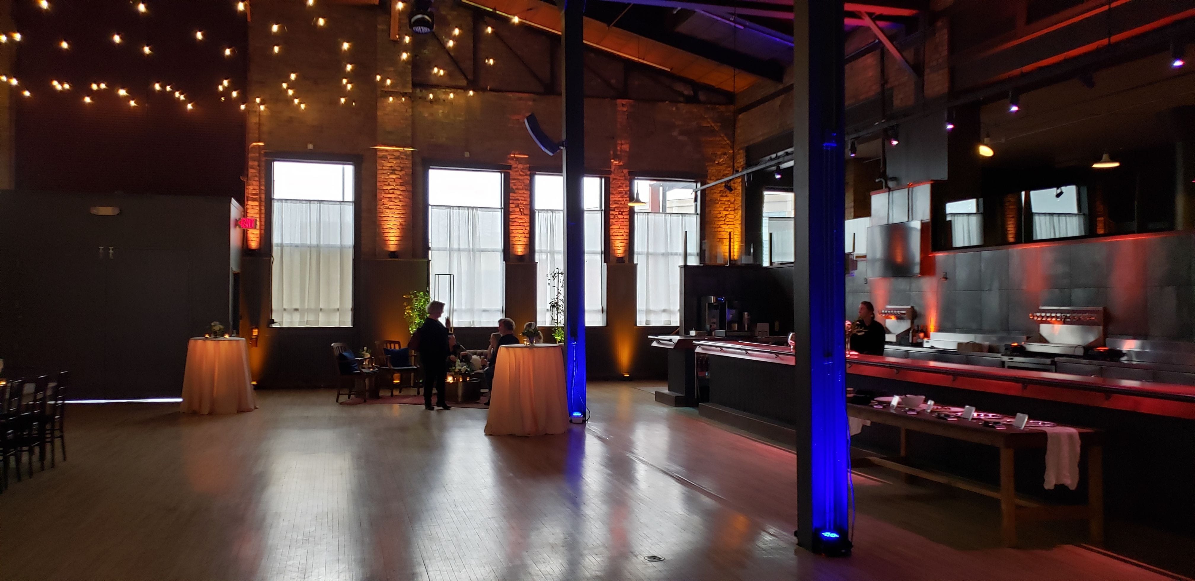 Blue and amber up lighting at The Garden in Canal Park by Duluth Event Lighting for a wedding.