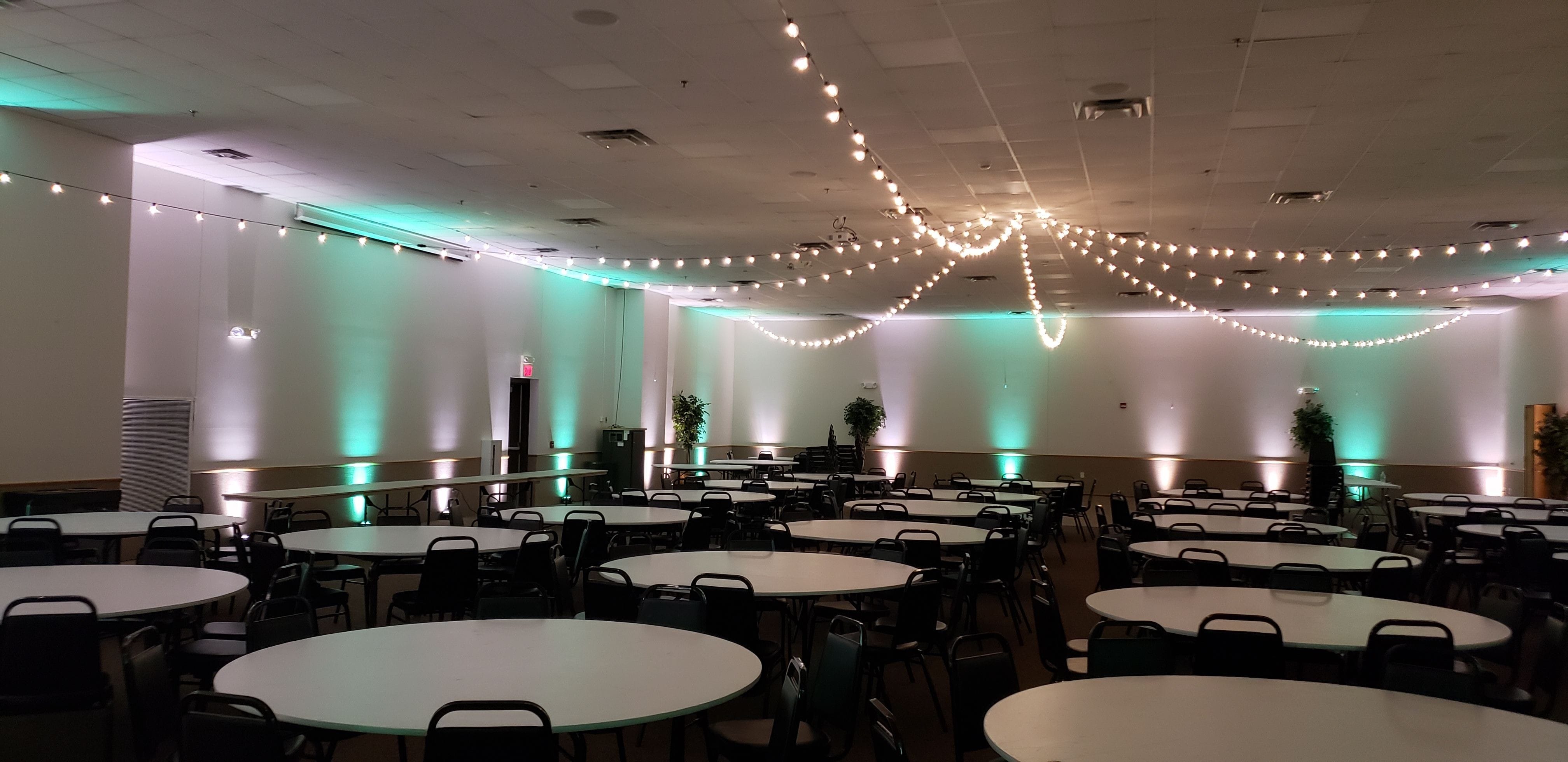 Wedding lighting at the AAD Shrine by Duluth Event lighting up lighting in mint green and soft white with a starburst design of bistro