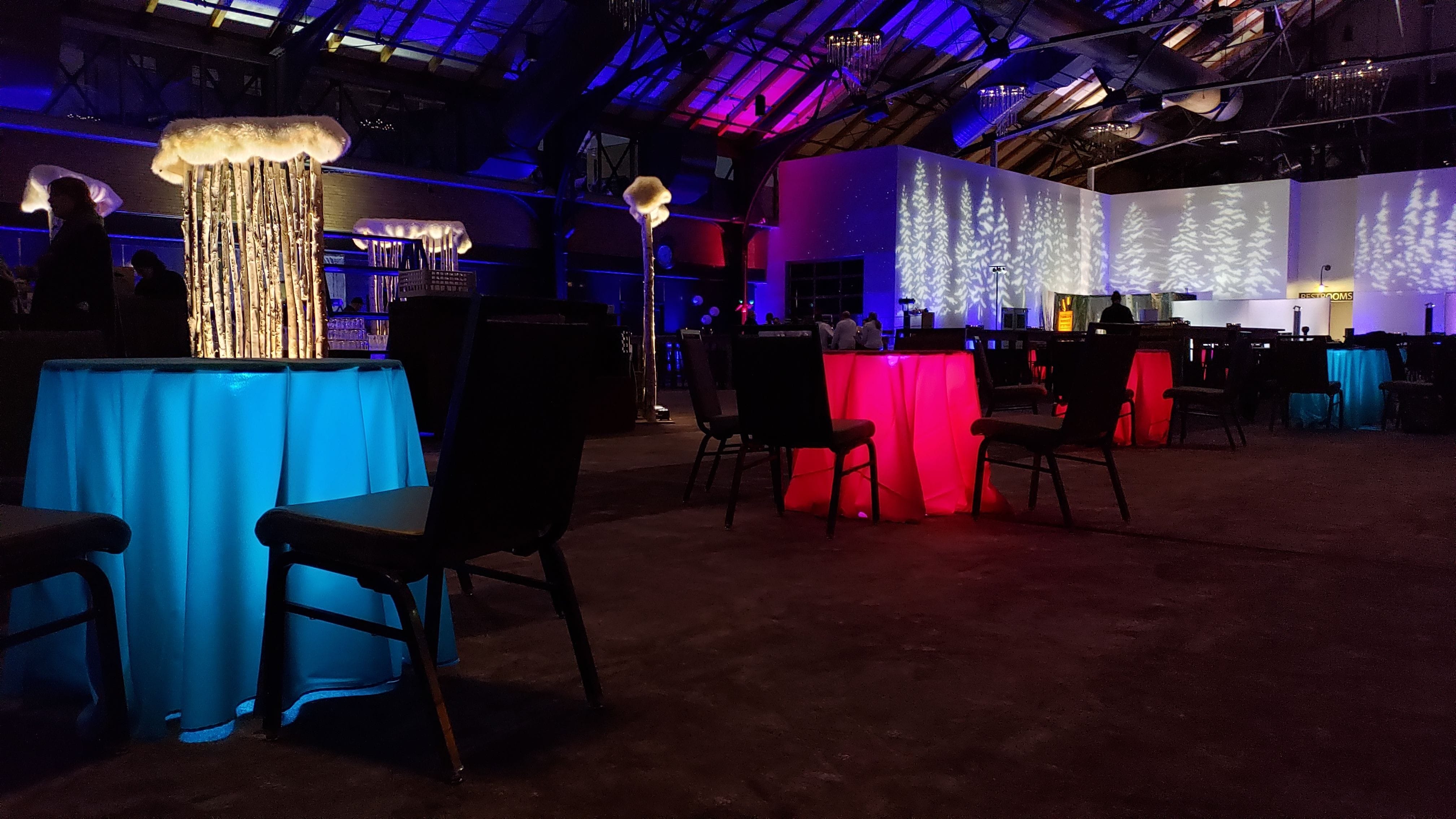 A North Woods themed party with glowing cocktail tables. Decor by Event Lab