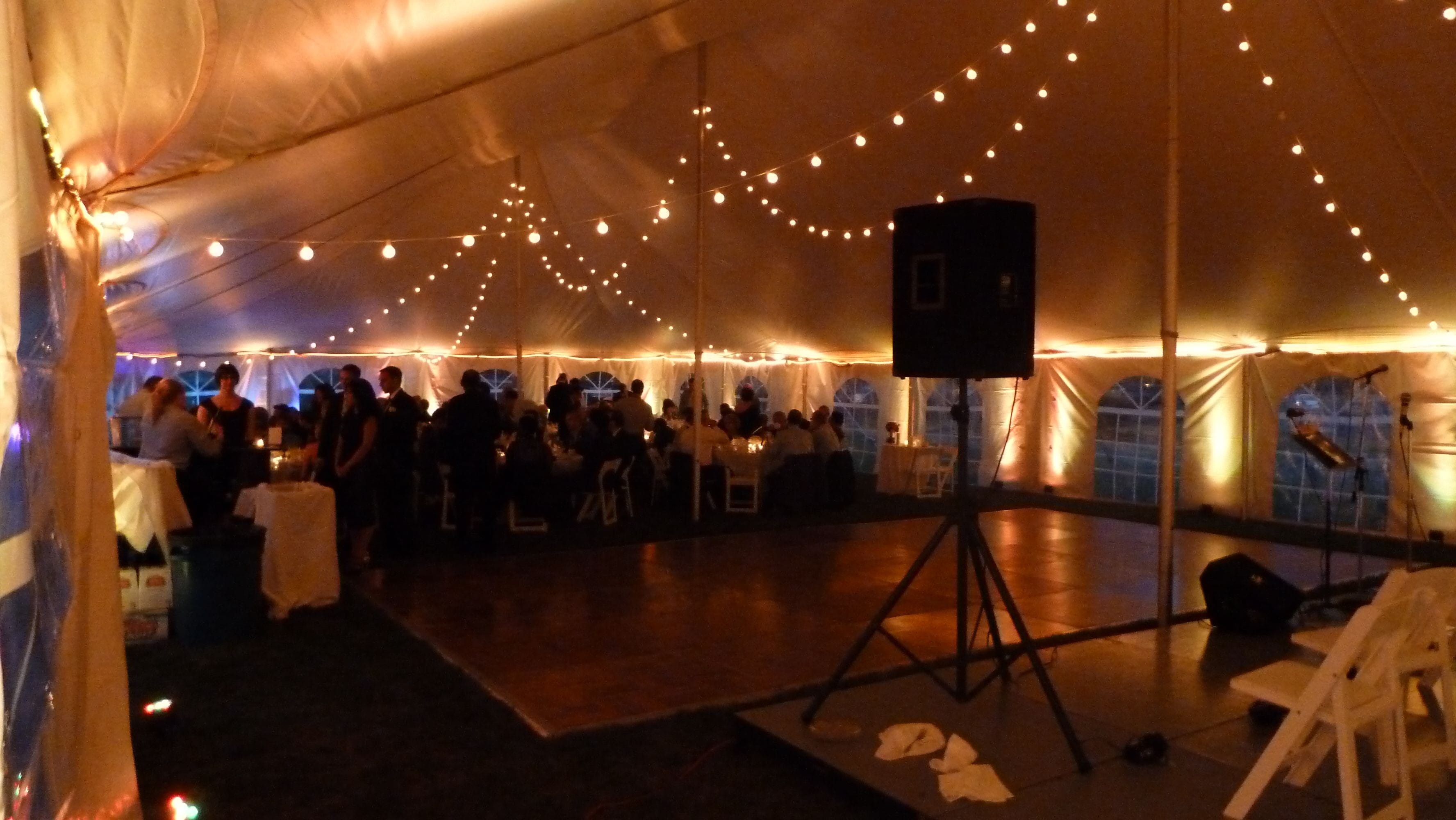 up lighting in soft gold with bistro in a tent. Up lighting by Duluth Event Lighting, bistro by @thevaultduluth