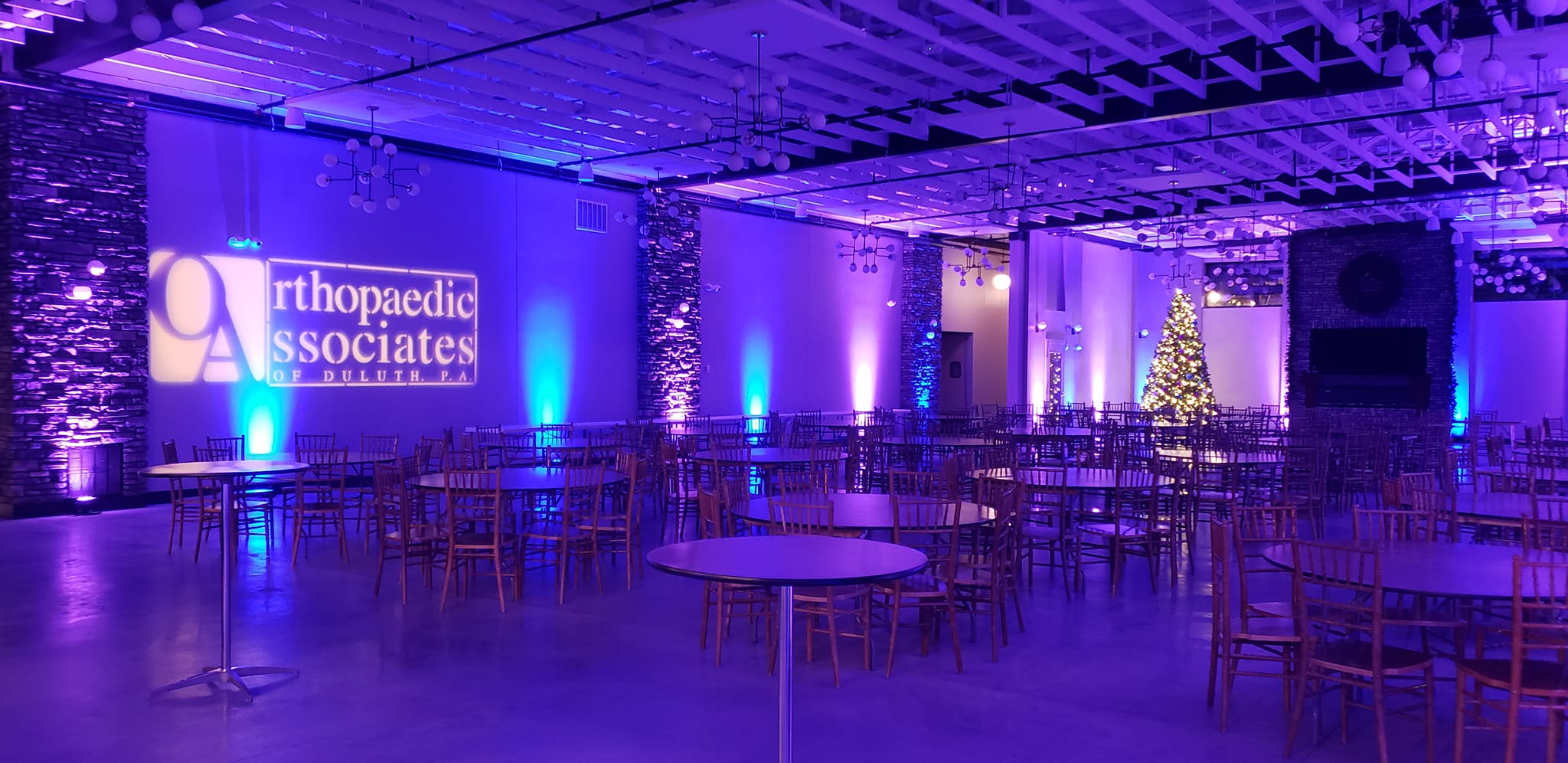 Pike Lake Golf and Beach Event center in blue and purple up lighting.